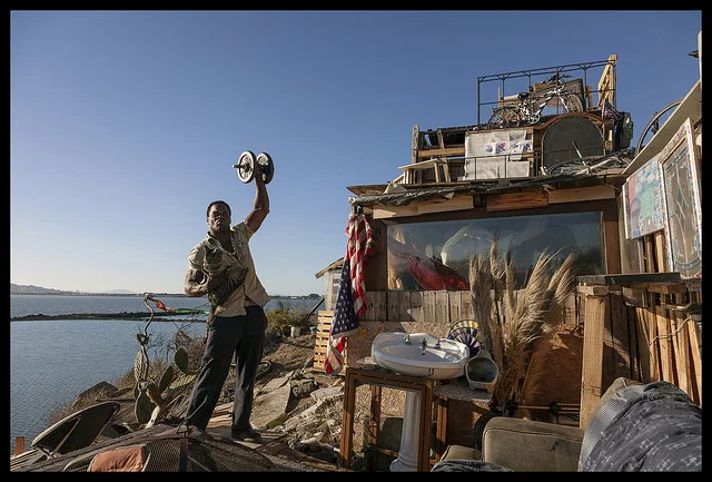 “Boxer Bob with Sugar Ray at Landfill Mansion” 32 x 50 inch archival ink jet photograph by Robin Lasser, 2014
