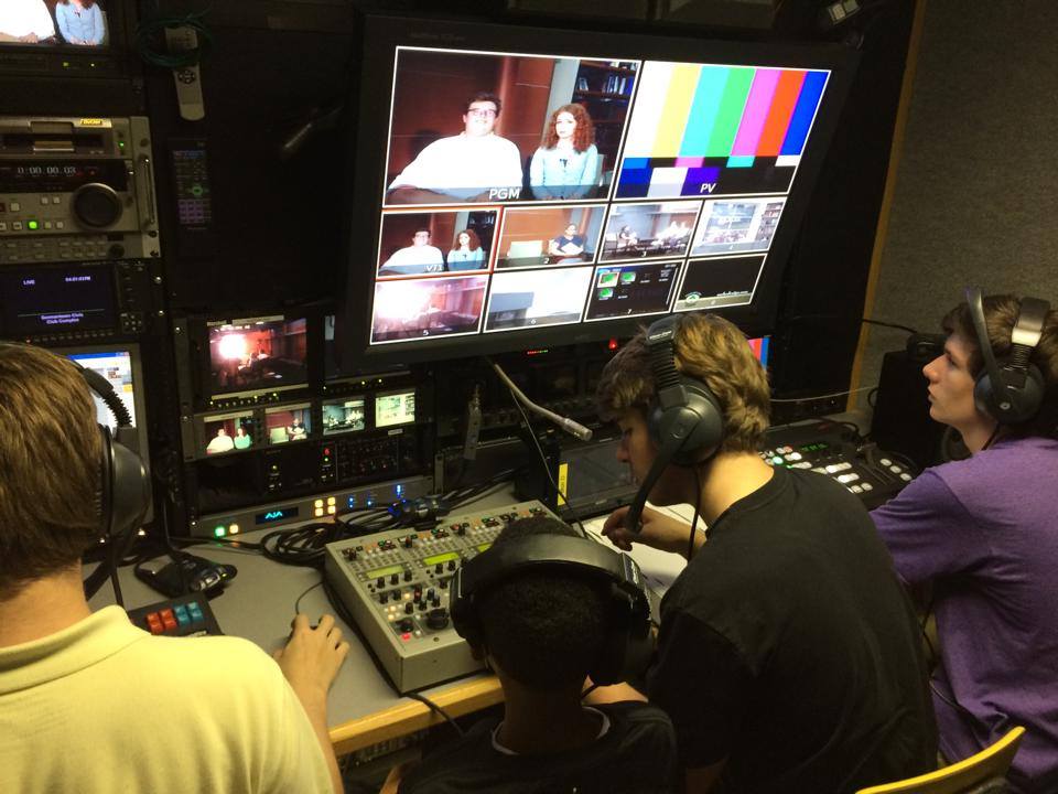 Germantown High School students, from left, Ben Taylor, Derrick Saulsberry, Sean Byrne and Ethan Morton rehearse in the C19 mobile unit forGHS-TV's Live Coverage of the 2014 Germantown Festival .
