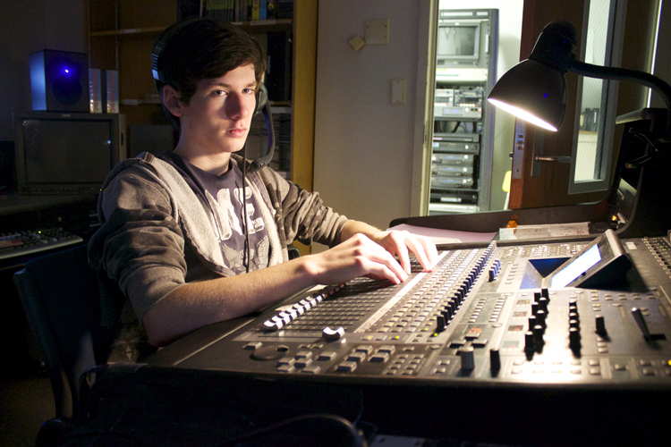  Ethan Morton has to remain focused throughout the live show when operating the audio board. He's responsible for 10 microphones as well as sound levels for the more than one dozen videos played during the production. 