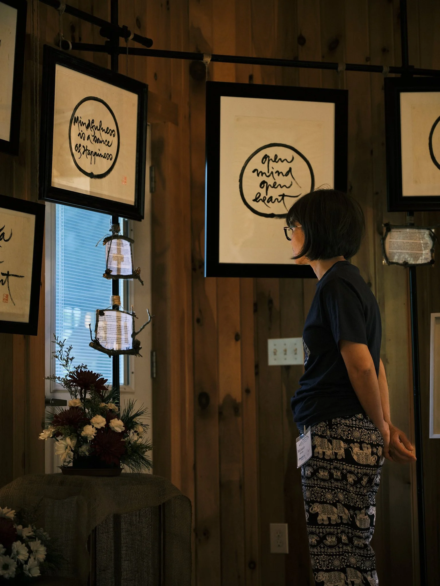 practitioner viewing challigraphy.jpg