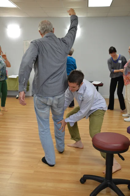  Aston Kinetics 102 students playing with Aston movement concepts. 