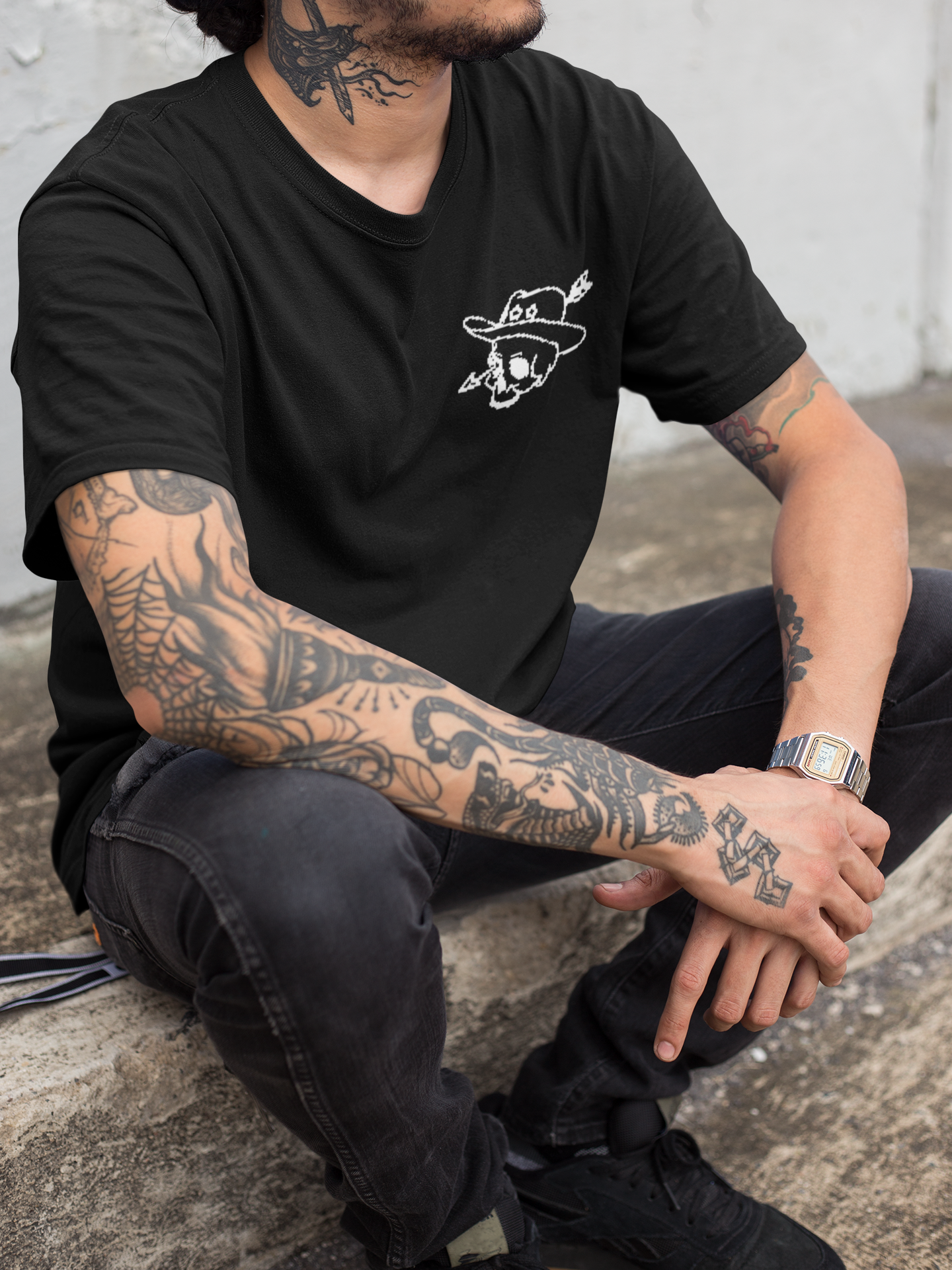 closeup-of-a-hispanic-tattooed-man-wearing-a-t-shirt-mockup-while-sitting-down-a17083-3.png