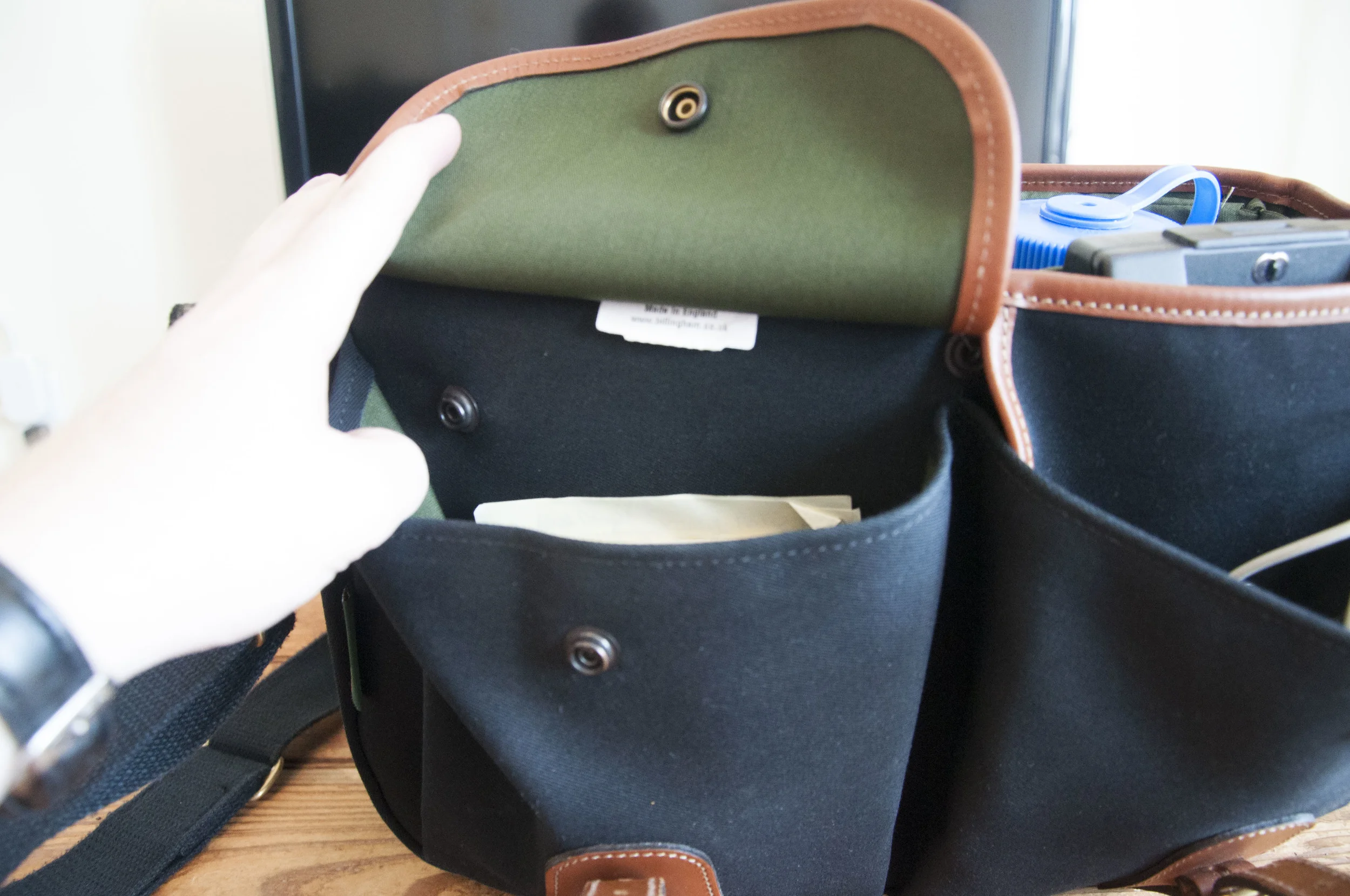 the front pockets come with a button i guess you could call it that allows the bag pocket to become bigger or smaller depending on what you put in there which is really helpful.
