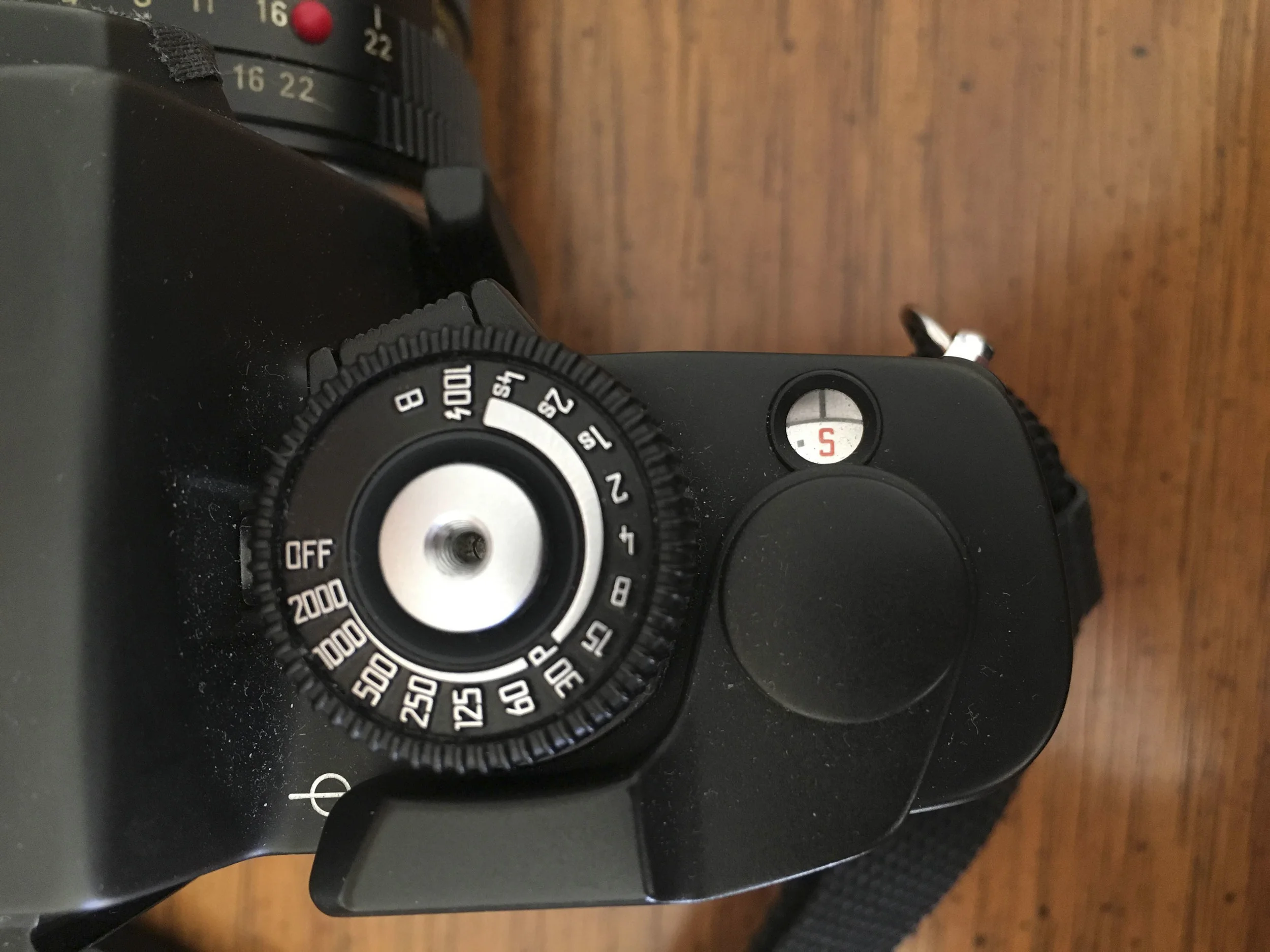 located on the shutter dial is the off button. The button the top of the dial with push and moved to the right changed the shooting mode. The R7 also has a cable release thread.
