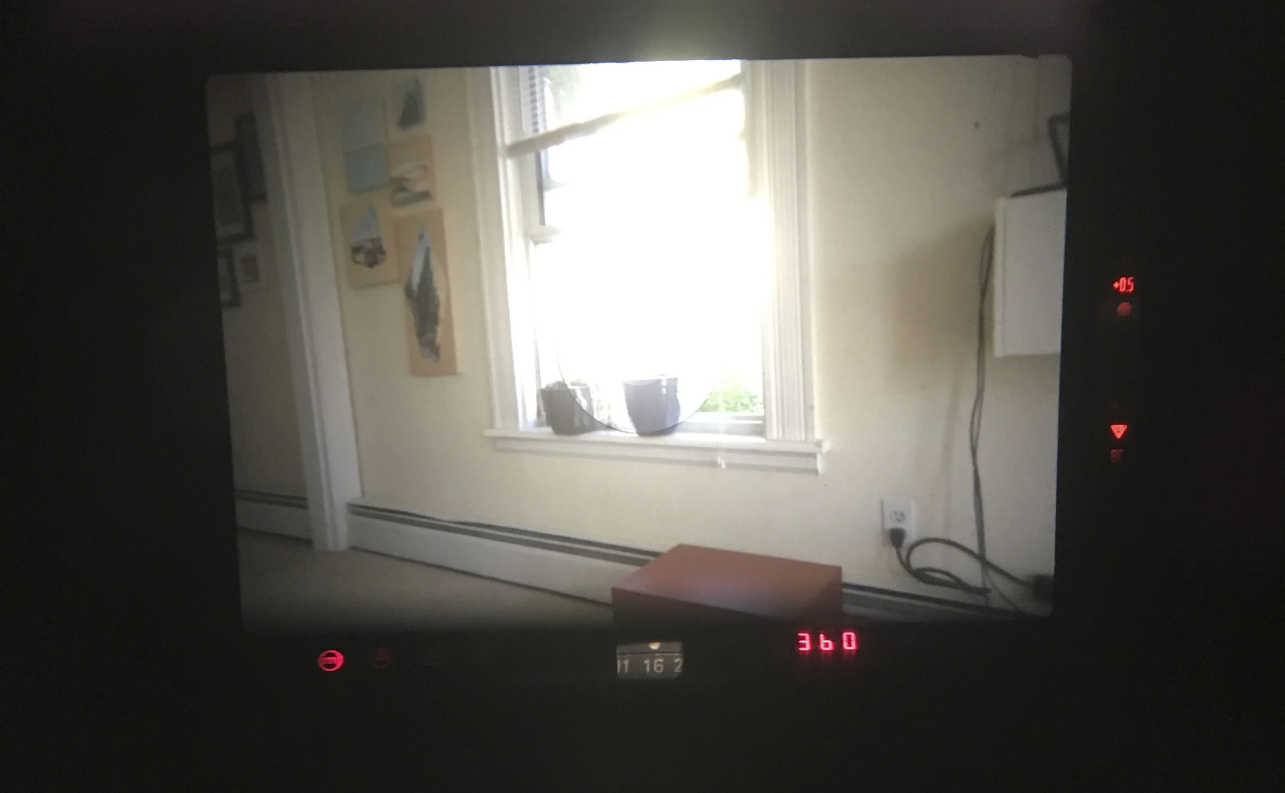 A view from the viewfinder. It is not very cluttered and its bright and the meter info is clear and cleanly layed out for you. You can also see that is it +0.5 over exposed and when exposed properly you will get a red dot in the middle.