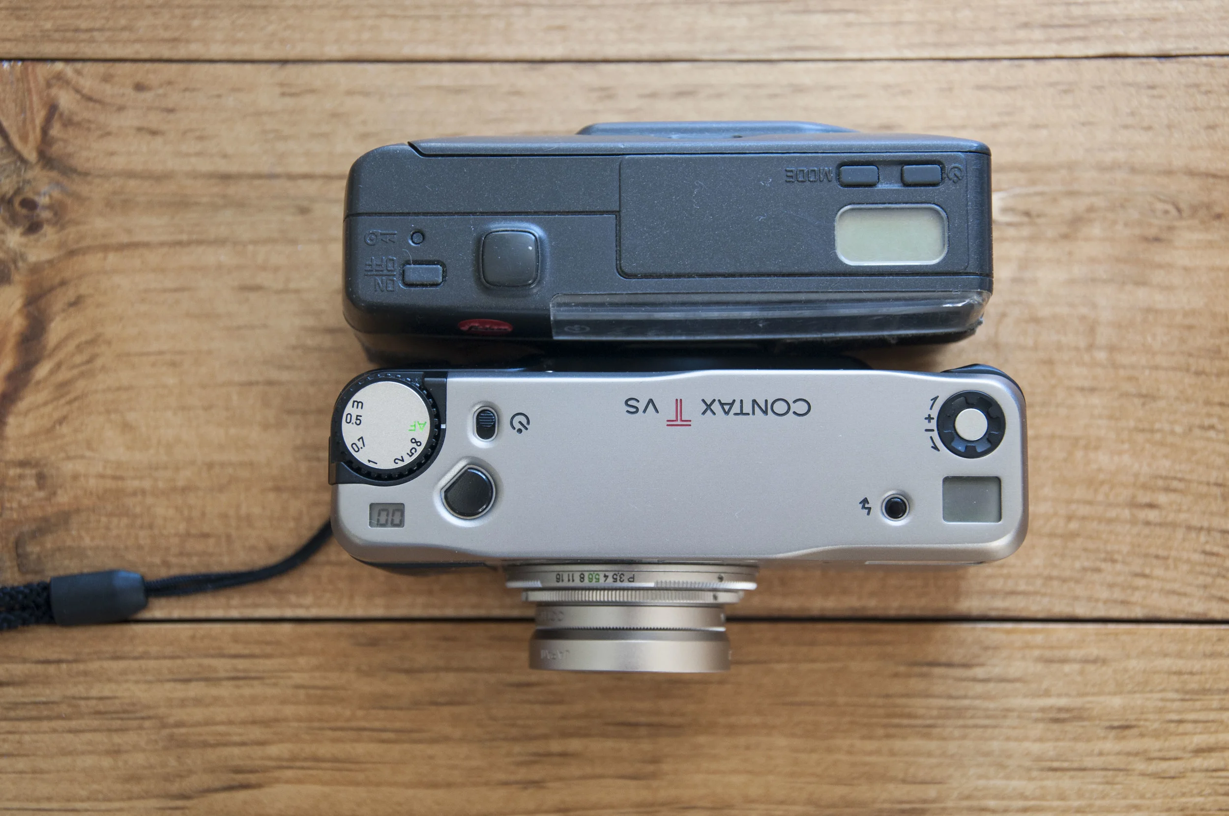  Size compasison of the Contax TVS and the Leica Mini and you can see the the TVS is a bit slime and longer but that lens sticks out a bit with the uv filter and hood which are both removable.