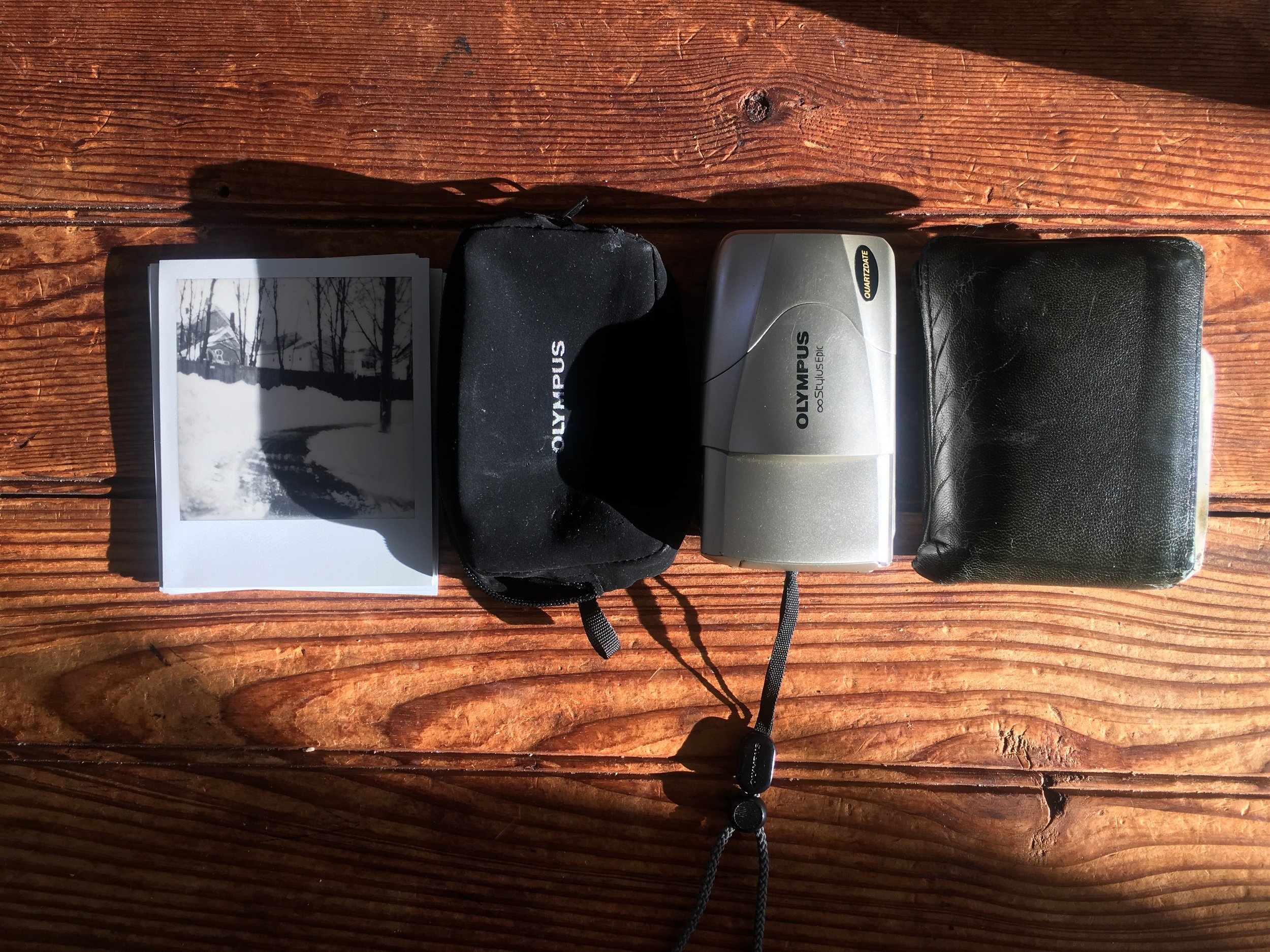 The size of this camera is remarkable and is about the size of my wallet and not much bigger than a i-Type film from the One Step 2. Oh yeah and thats a felt olympus pouch for the camera. I'm a sucker lame camera accessories and it helps keep the camera a little more safe.