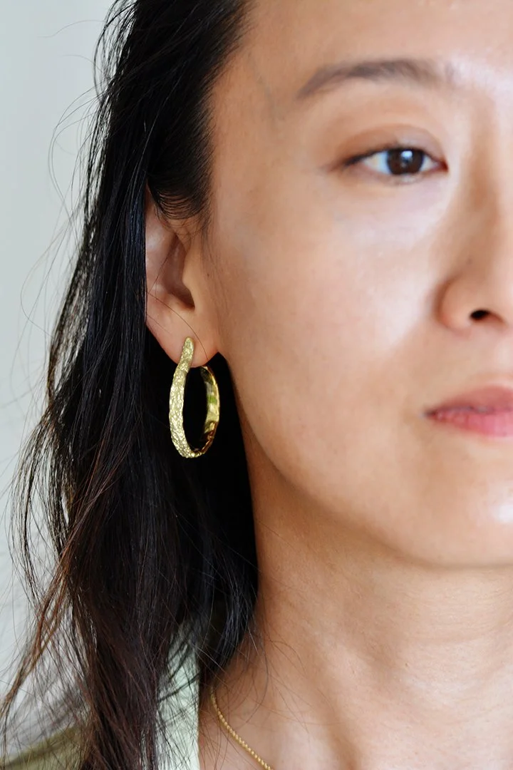 Francesca-Lacagnina-18K-Gold-Coral-Textured-Large-Hoop-Earrings-E125G18-ON MODEL-Side-View.jpg