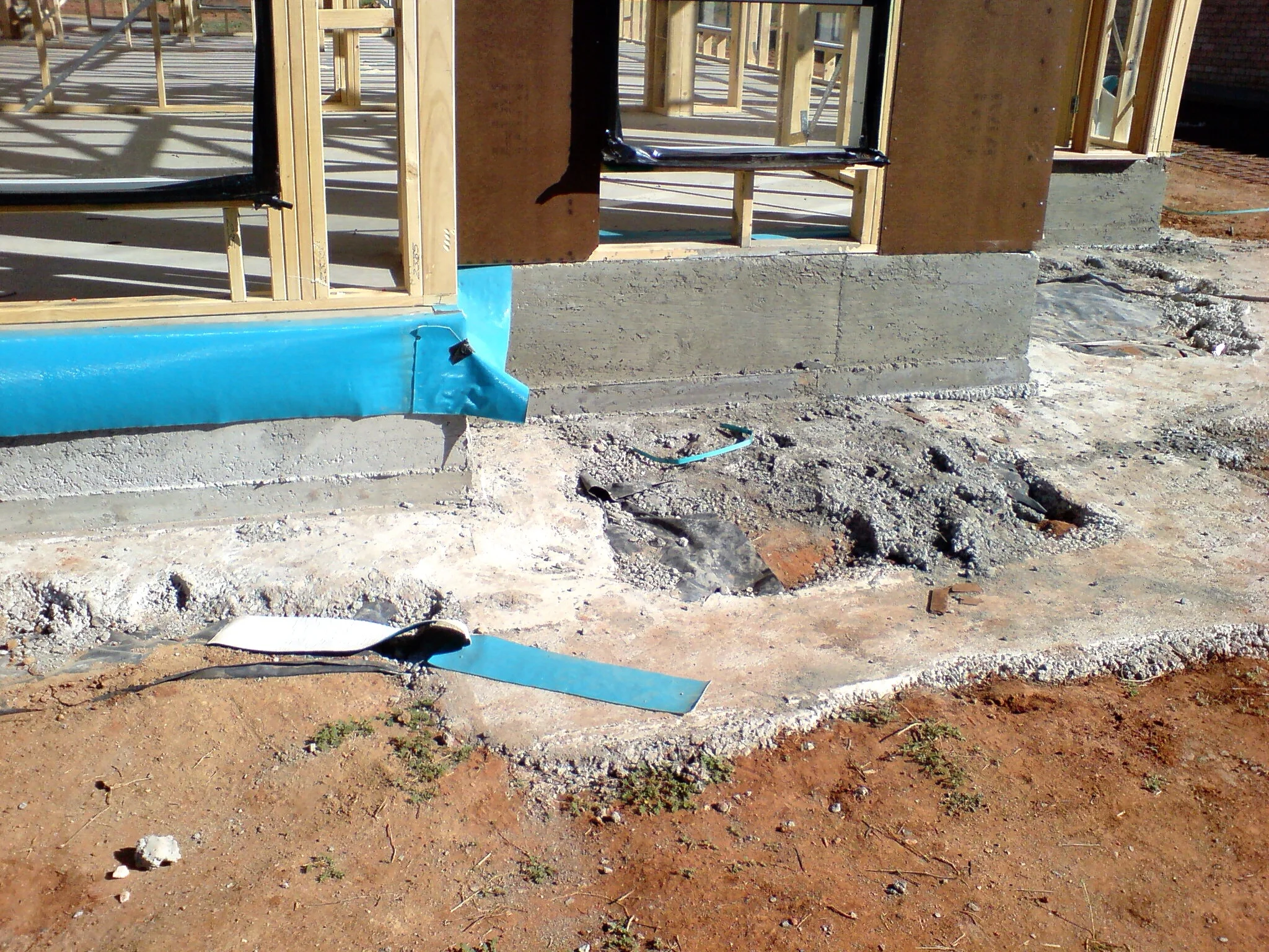 The barrier here has been damaged and folded over during frame installation.