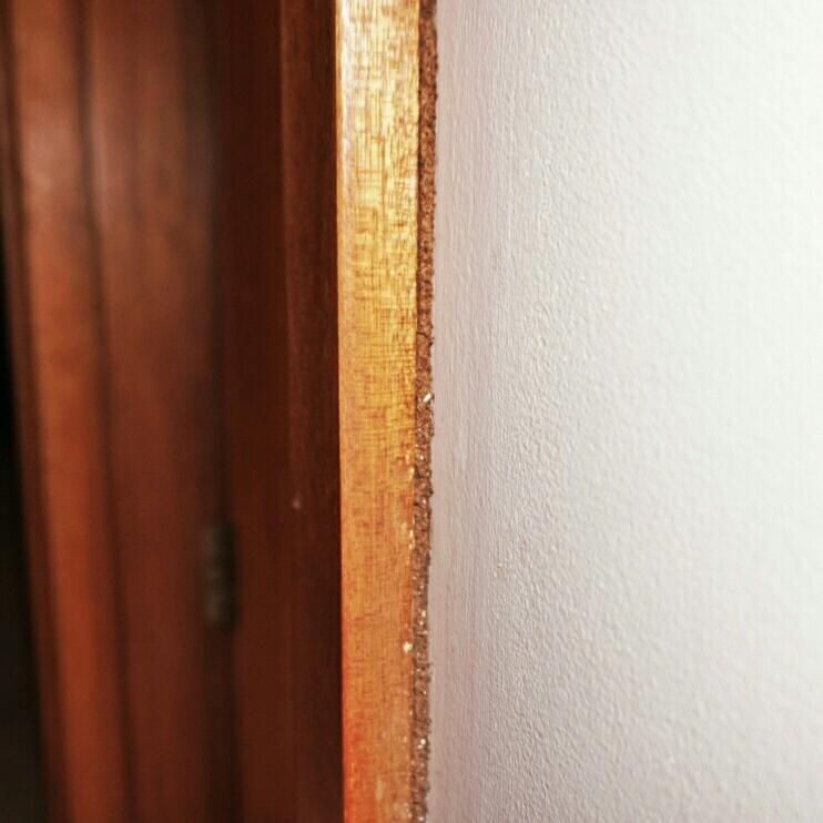 Termite mud packed in behind this architrave is a dead giveaway. Although it may seem really obvious, sometimes the orientation of the door makes it hard to look at the doorway side on.