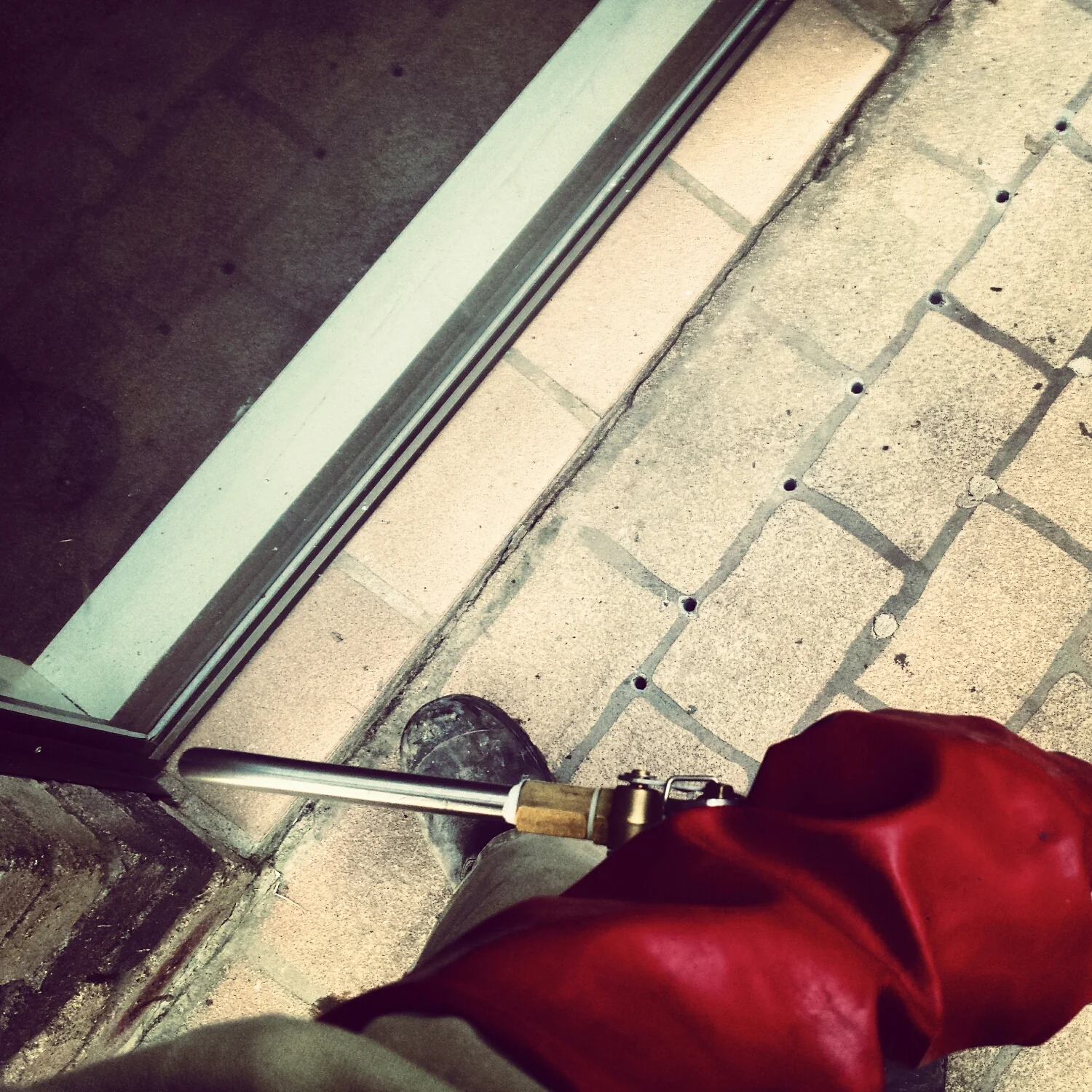 Injecting Termidor under a slab.