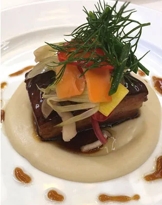 The umami-laden Pork Belly with Umeboshi Glaze and Dashi Poached Turnip Purée (Photo: VeritageMiami)