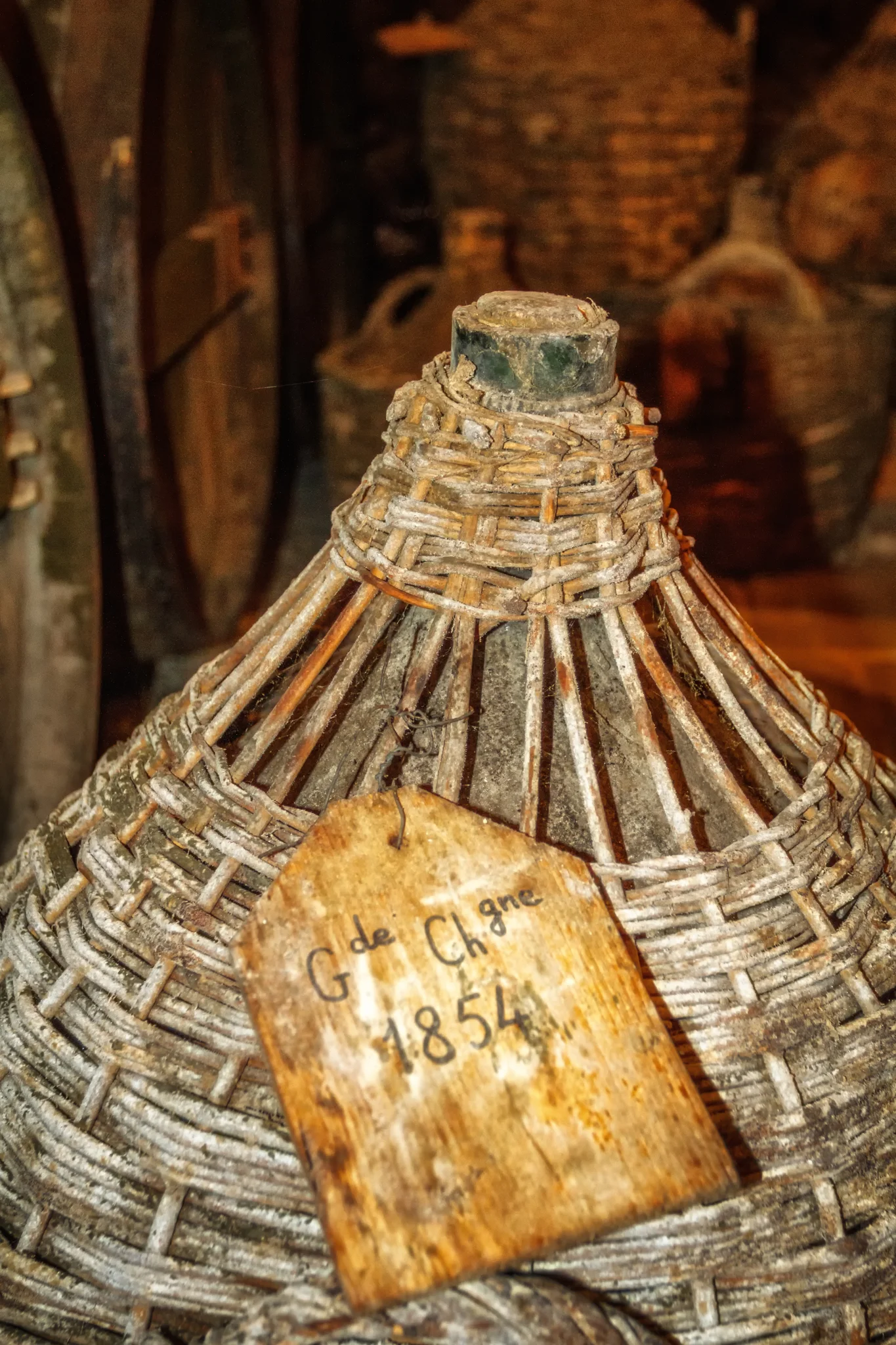 A wicker-clad Dames-Jeanne of 1854 Cognac in the Paradis of Cognac Hardy (Photo Lyn Farmer)