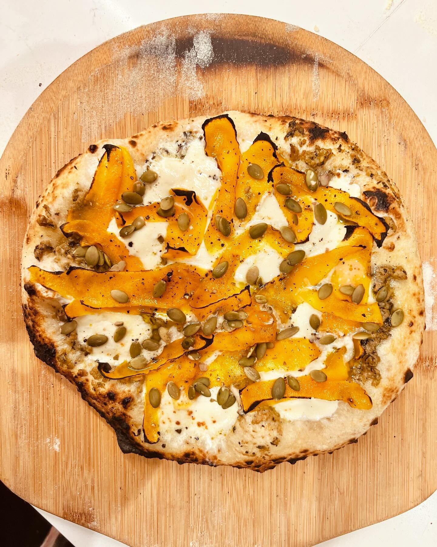 I&rsquo;m practicing to be ready for National Pizza Day Friday. This is a combination of pesto, tapenade,burrata and butternut squash shavings marinated in olive oil, with a few pepitas thrown in for crunch and contrast. Hit the spot with a zippy whi