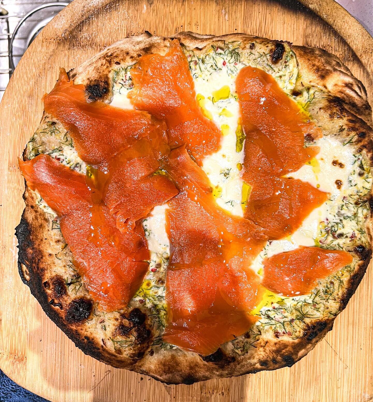 Starting another night with pizza - Nordic style with smoked salmon added after cooking the crust with cr&egrave;me fra&icirc;che, dill, lemon and cracked pink peppercorns (terrific with @champagnephilippegonet exceptional ros&eacute; Champagne) and 