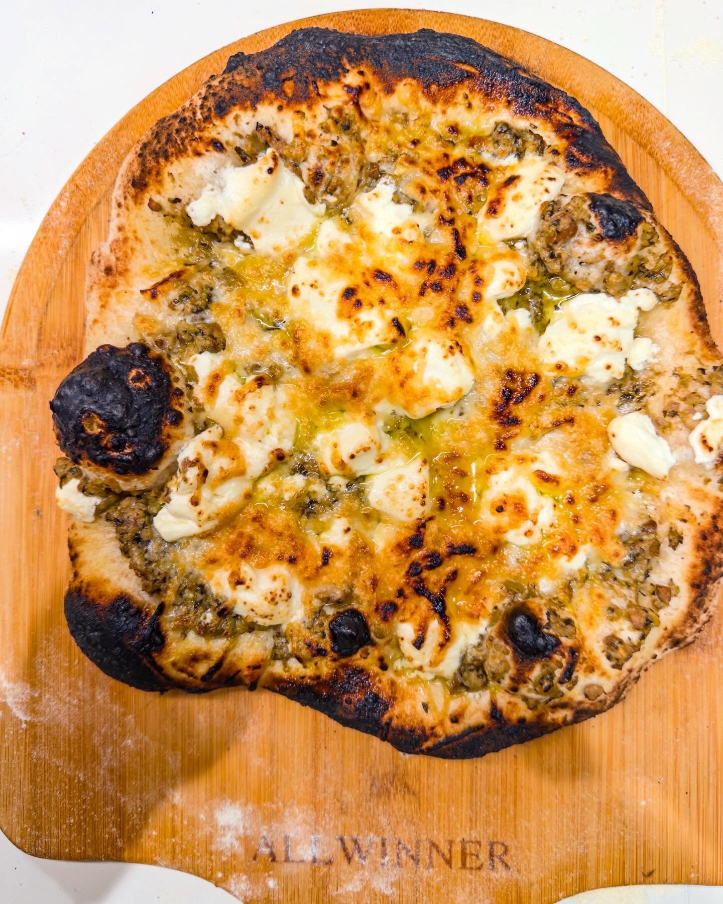 More pre-Christmas pizzas - basil pesto with goat cheese and artichoke with lemon pesto. Ready now for Noche Buena with my Cuban posse
