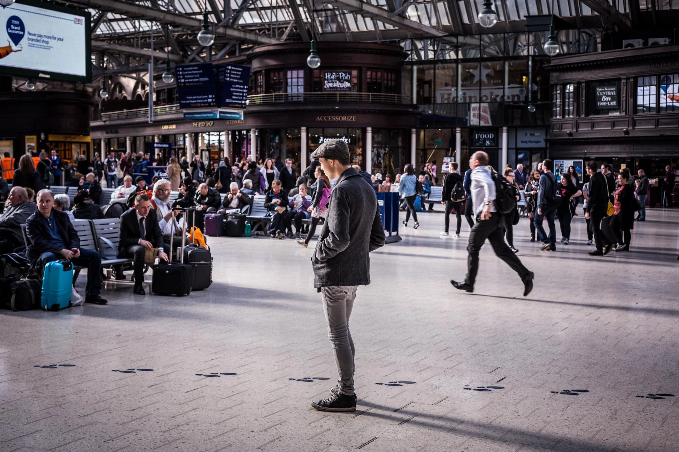 young man in train station-glasgow-scotland-Spid Pye-B6C1893.jpg