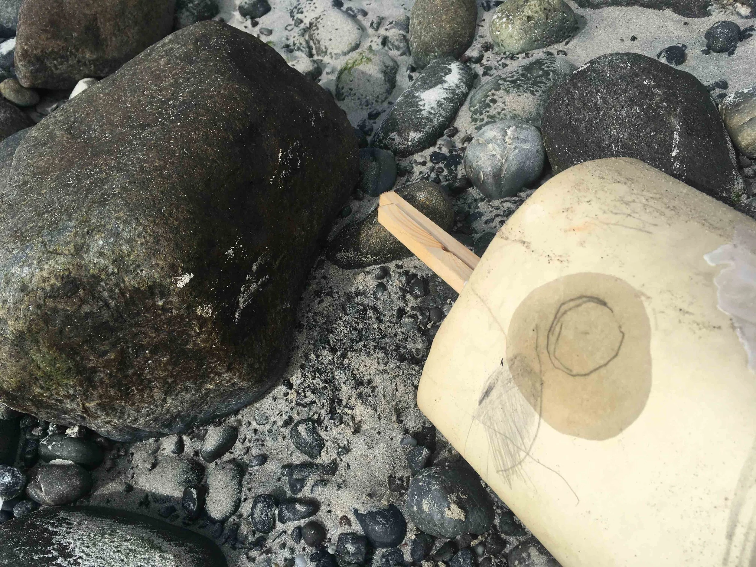circular markk on scroll and stoane.jpg