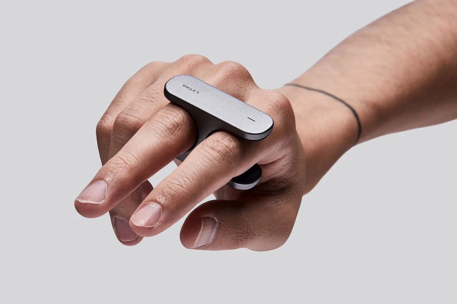 LITHO itself is a small finger-worn controller that connects to your smartphone or headset