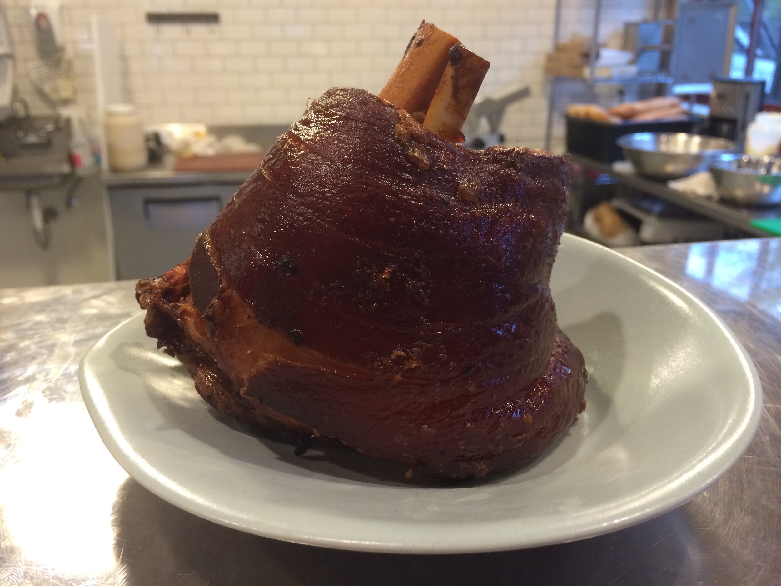 Schweinshaxe - hard to say, easy to cook. It's a pork shank, braised in a rich bone broth. We cook it for hours so you don't have to.