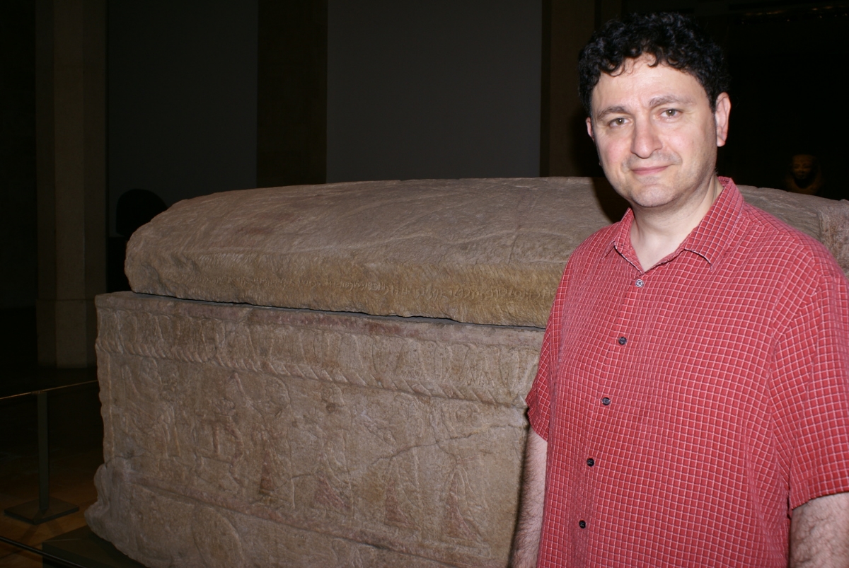 Author Michael Joseph Murano standing in front of the sarcophagus of King Ahiram, at the National Museum of Beirut, Lebanon.