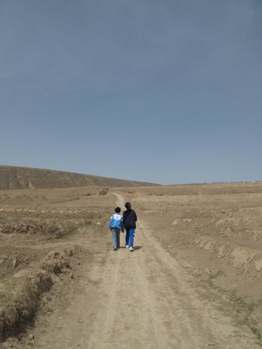 A long walk home - Cherry walks one of the students home during a volunteer trip in rural China