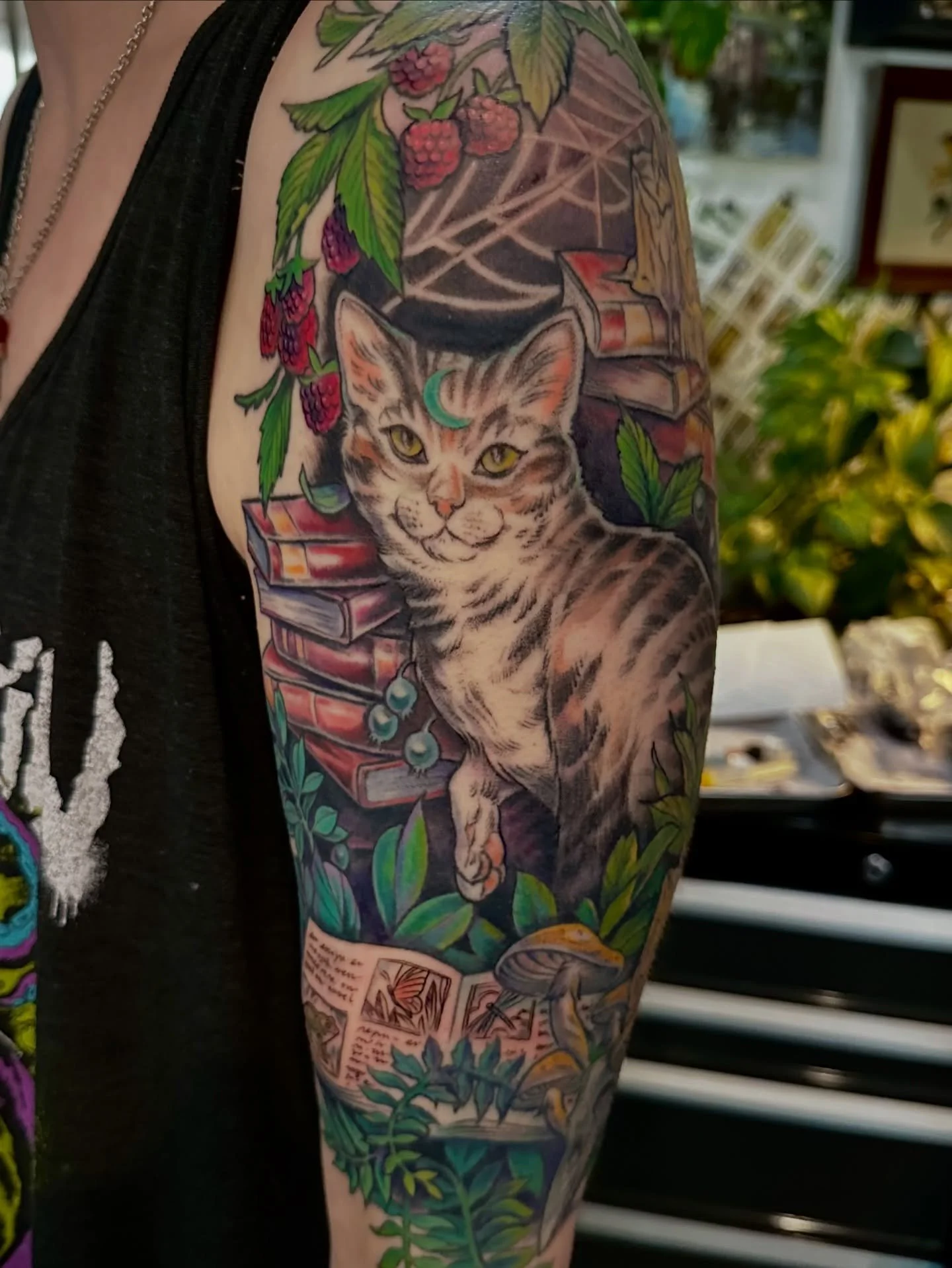 Thank you so much, Liz! We finally finished up your mystical kitty tattoo and I love it so much! Most of this is healed with the exception of the little bits in the book and a few tiny spots in the raspberries and a bit of purple shadow! I feel so aw