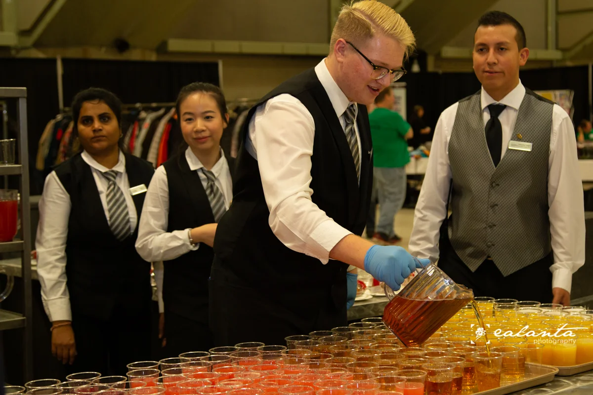 ECC Staff pouring drinks.JPG