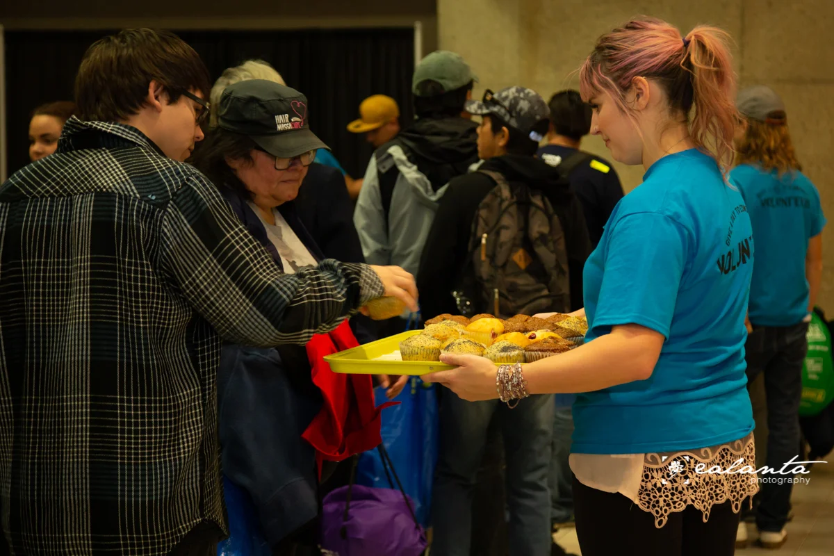 Volunteer celia with muffins.JPG