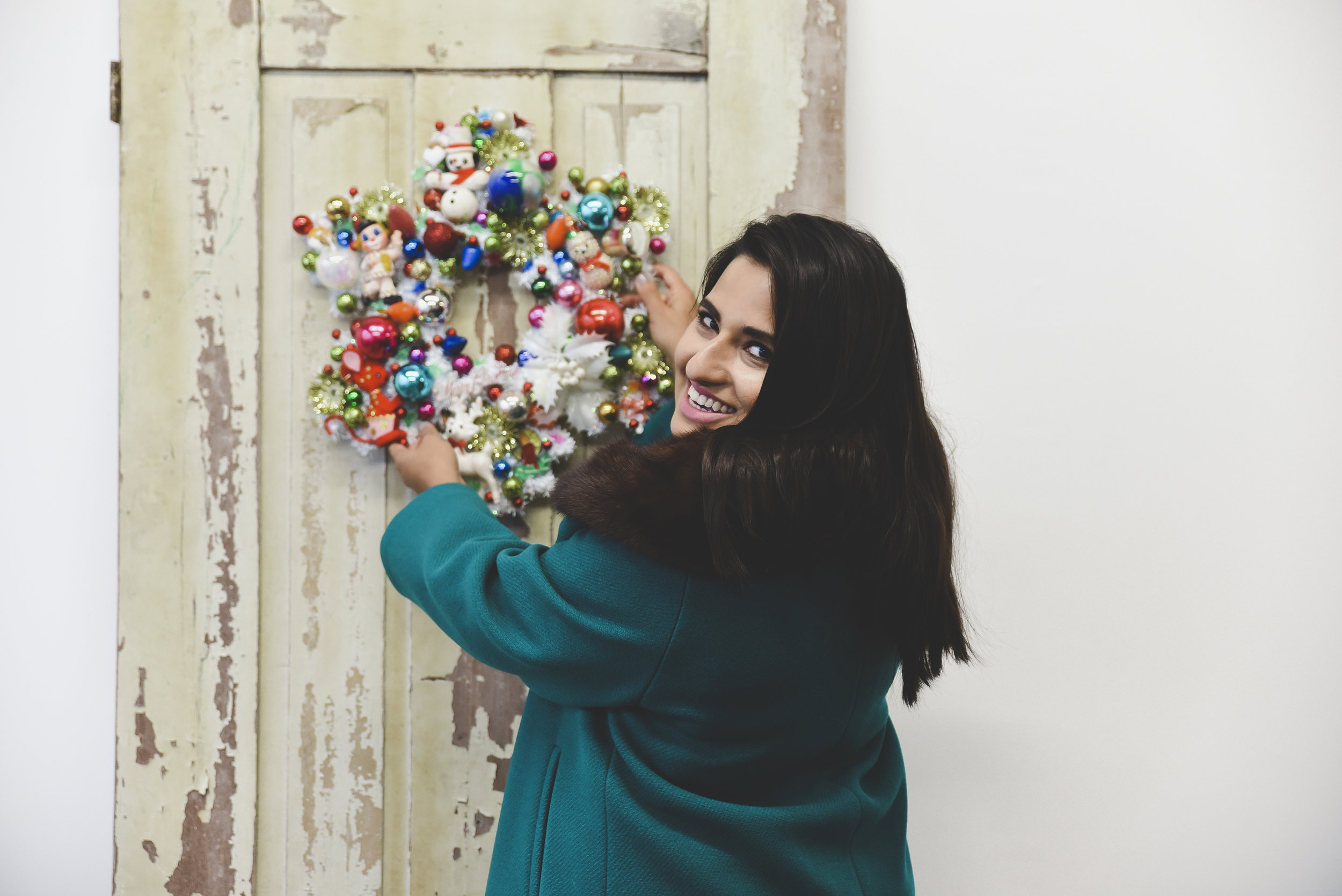 Door from Cushman Trade Co., Wreath by Black Kitten Vintage, and Coat from Great Lake Outfitters