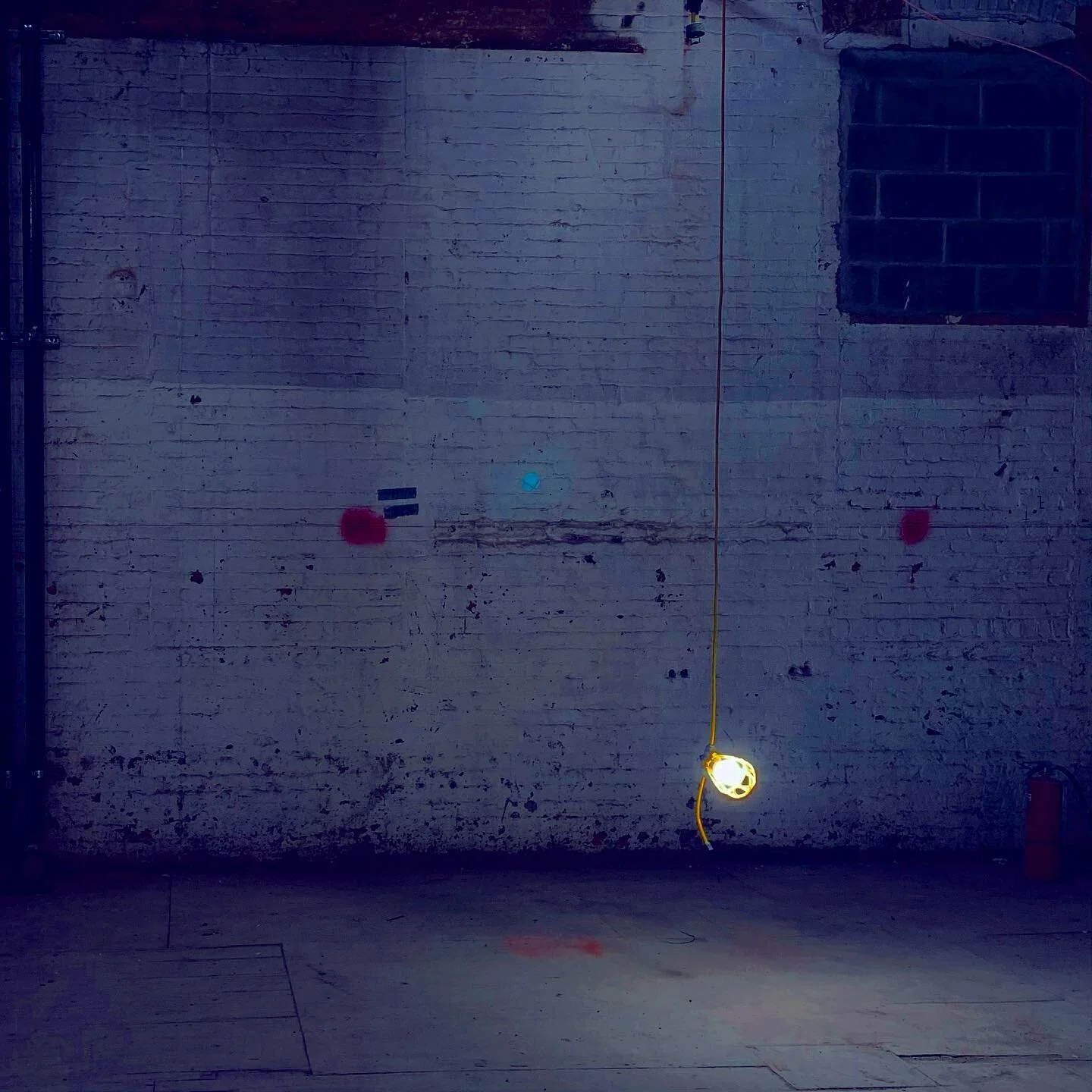 when I saw this lamp it reminded me of a ghost light used for when a stage goes dark in a theater, illuminating the complete darkness with a single bulb.

for the superstitious among us, it really is a way to appease the ghosts of the characters/acto