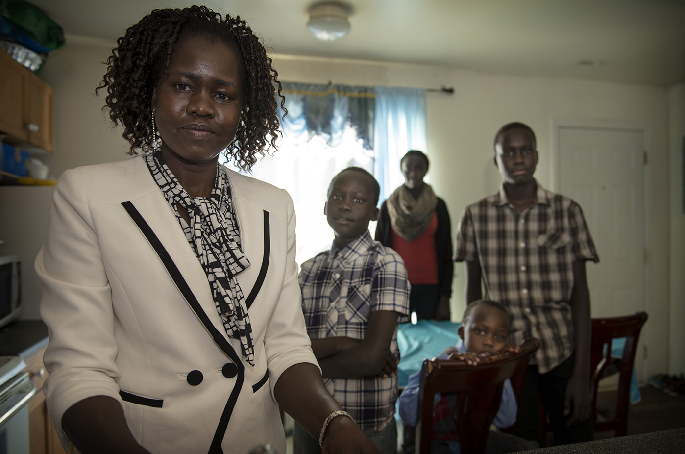 Tabitha David (left) has struggled to care for her four children Khedit, 9, Nyakim, 14, Luke, 5, and Thow, 12 for the past decade. She recently had to quit her job to care for Luke once childcare became too expensive.