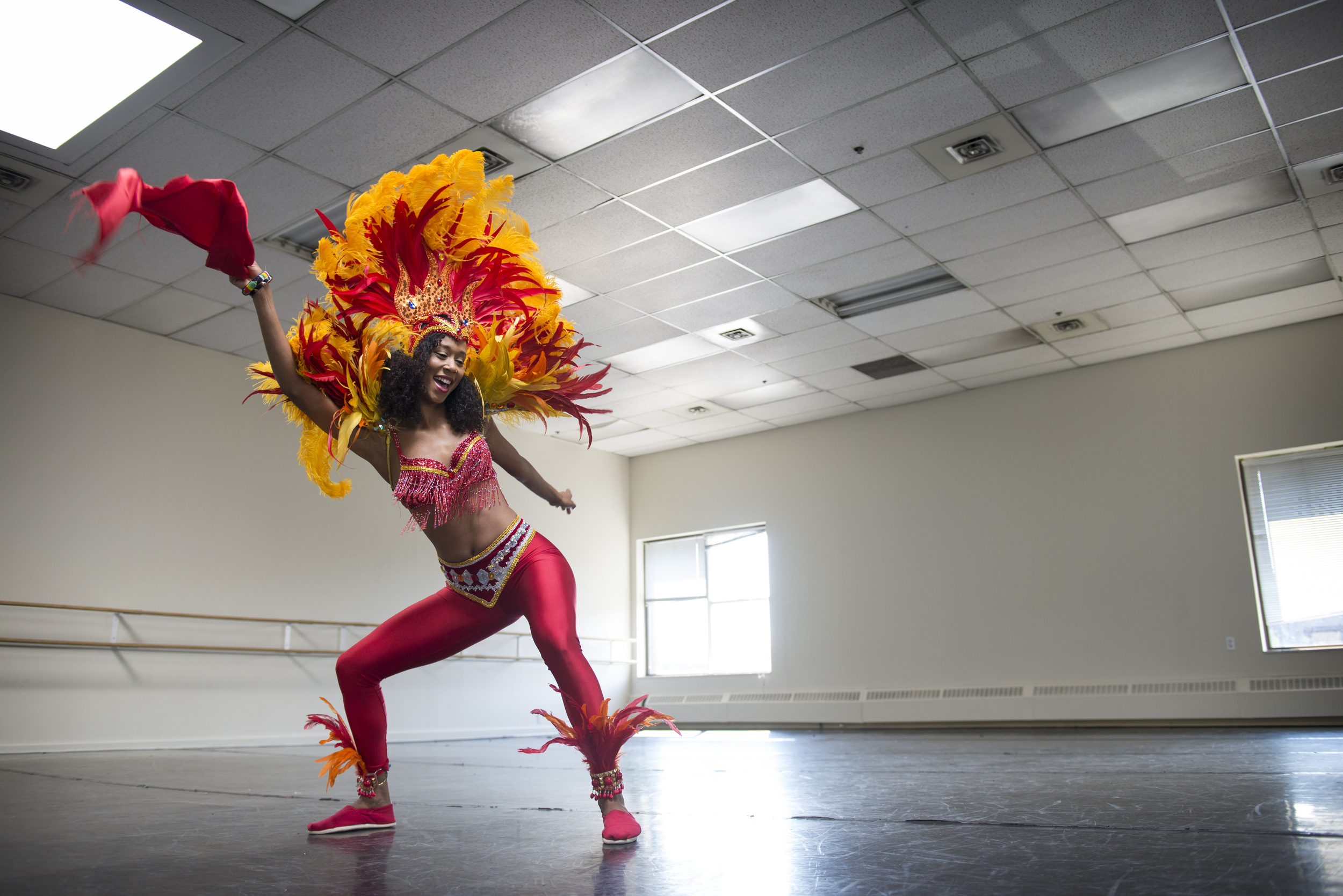 Caribbean dancer, Sabrina "Naz" Comanescu, runs a non-profit youth dance group called the Diversity Performing Arts Club of Calgary (DPACC). It was started by her mother 14 years ago, and Comanescu keeps the tradition going here at Decidedly Jazz Danceworks.
