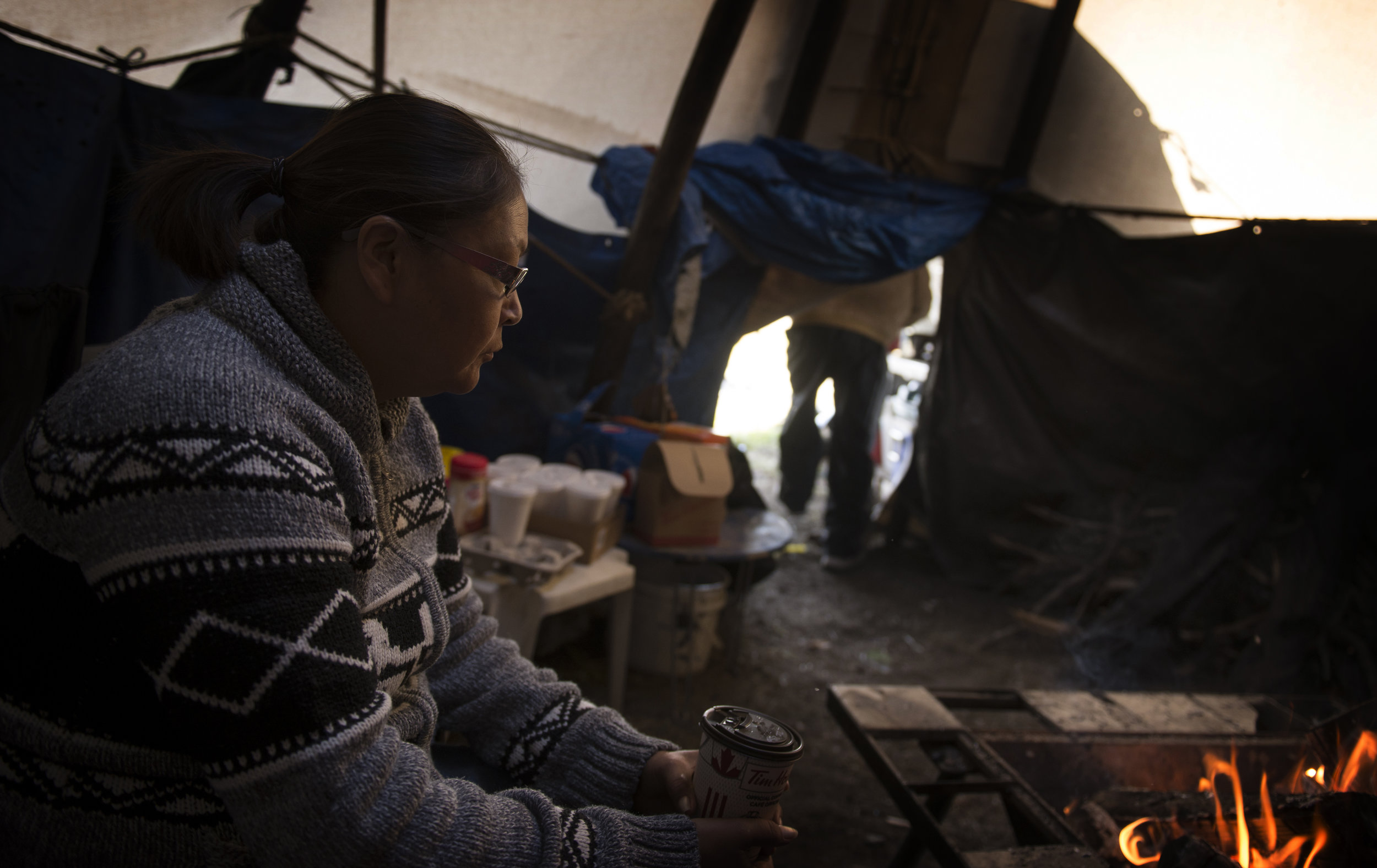 Myra Crow-Chief, Ben Crow-Chief’s wife, sits inside their teepee on Siksika Nation.