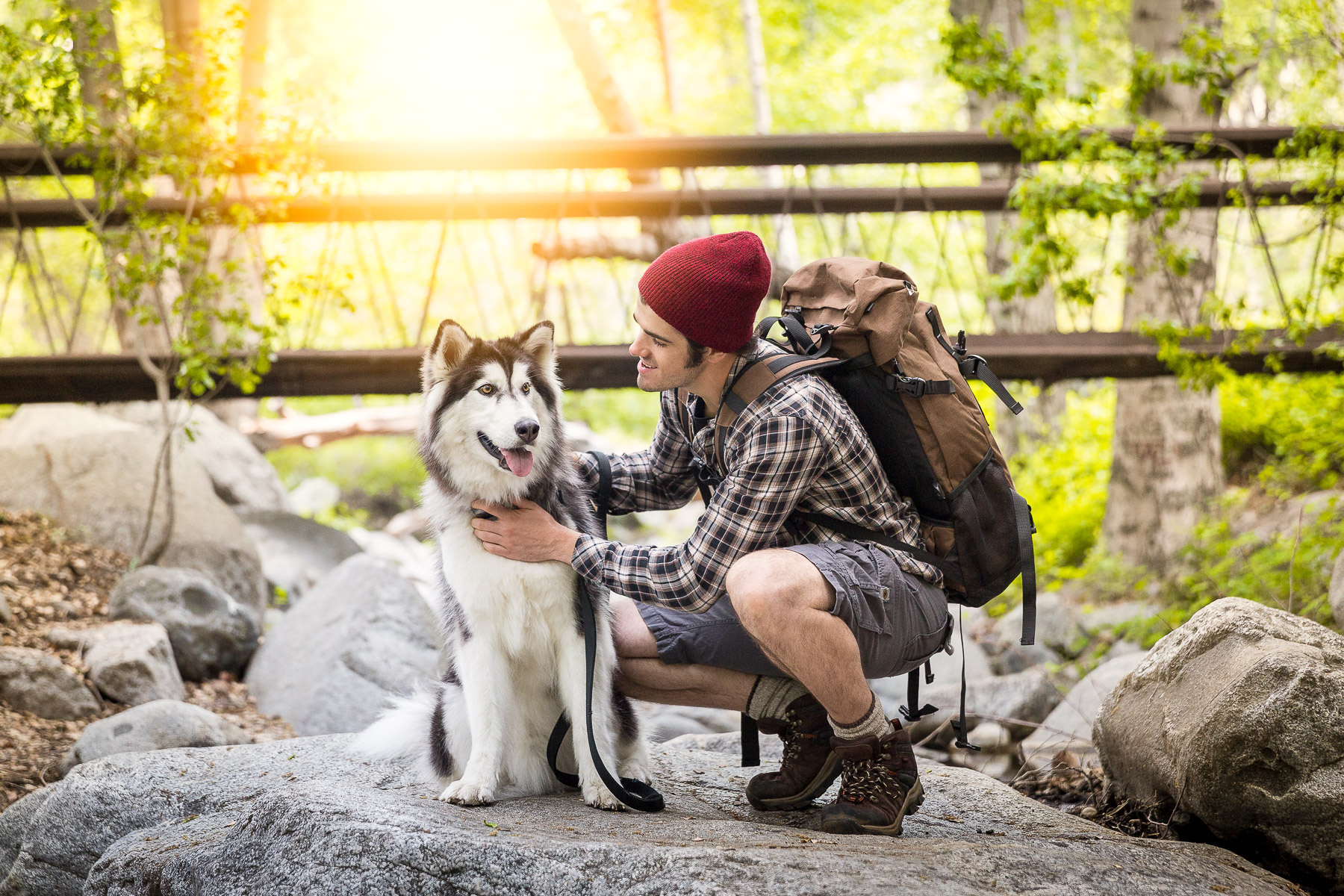 husky-dog-and-man-on-river-hike-woods-together-dog-photography.jpg