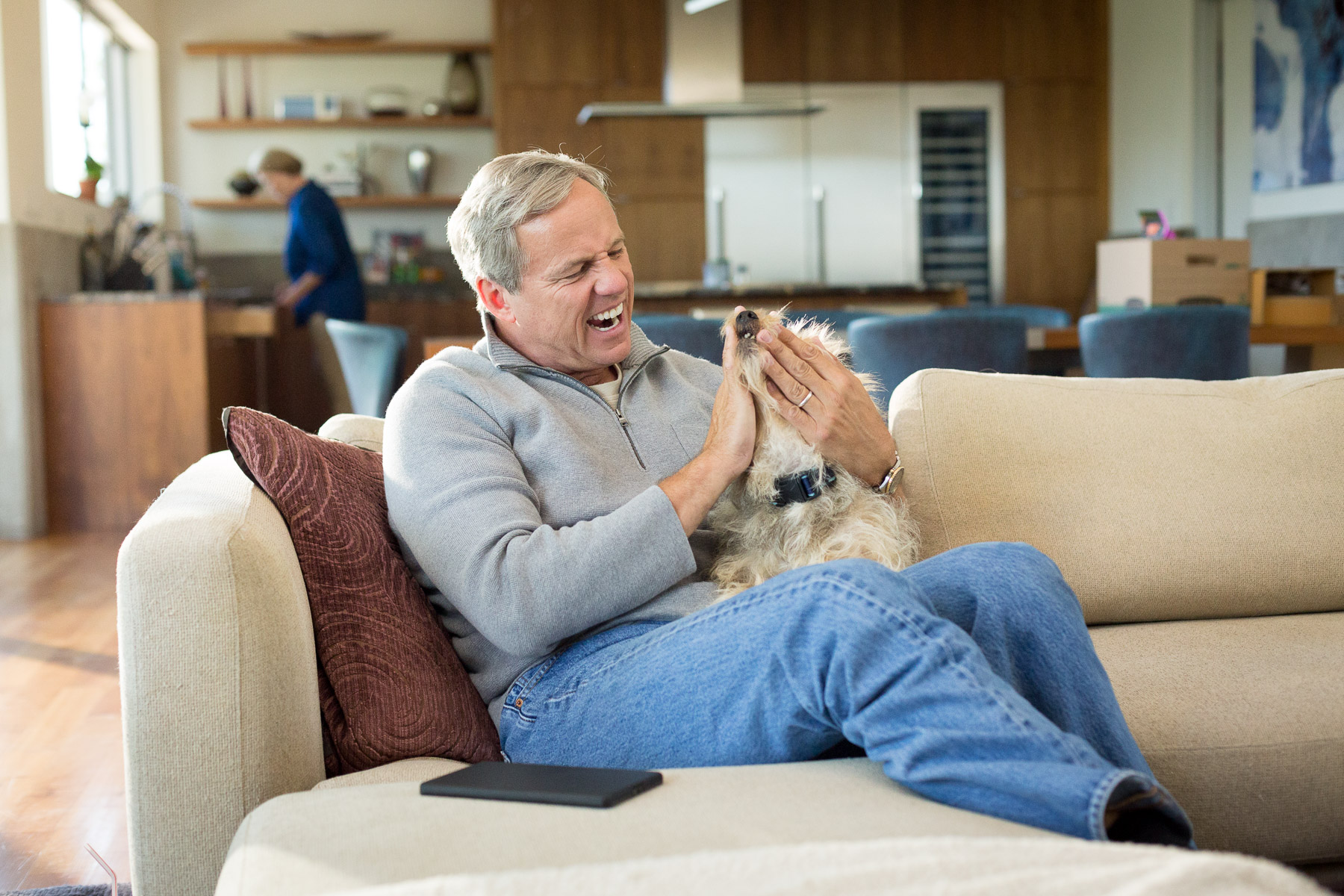 man-playing-with-mutt-dog-at-home.jpg