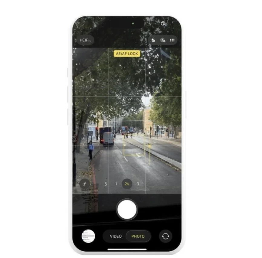 iPhone camera screen with AE/AF Lock enabled to hold focus and exposure on a street scene