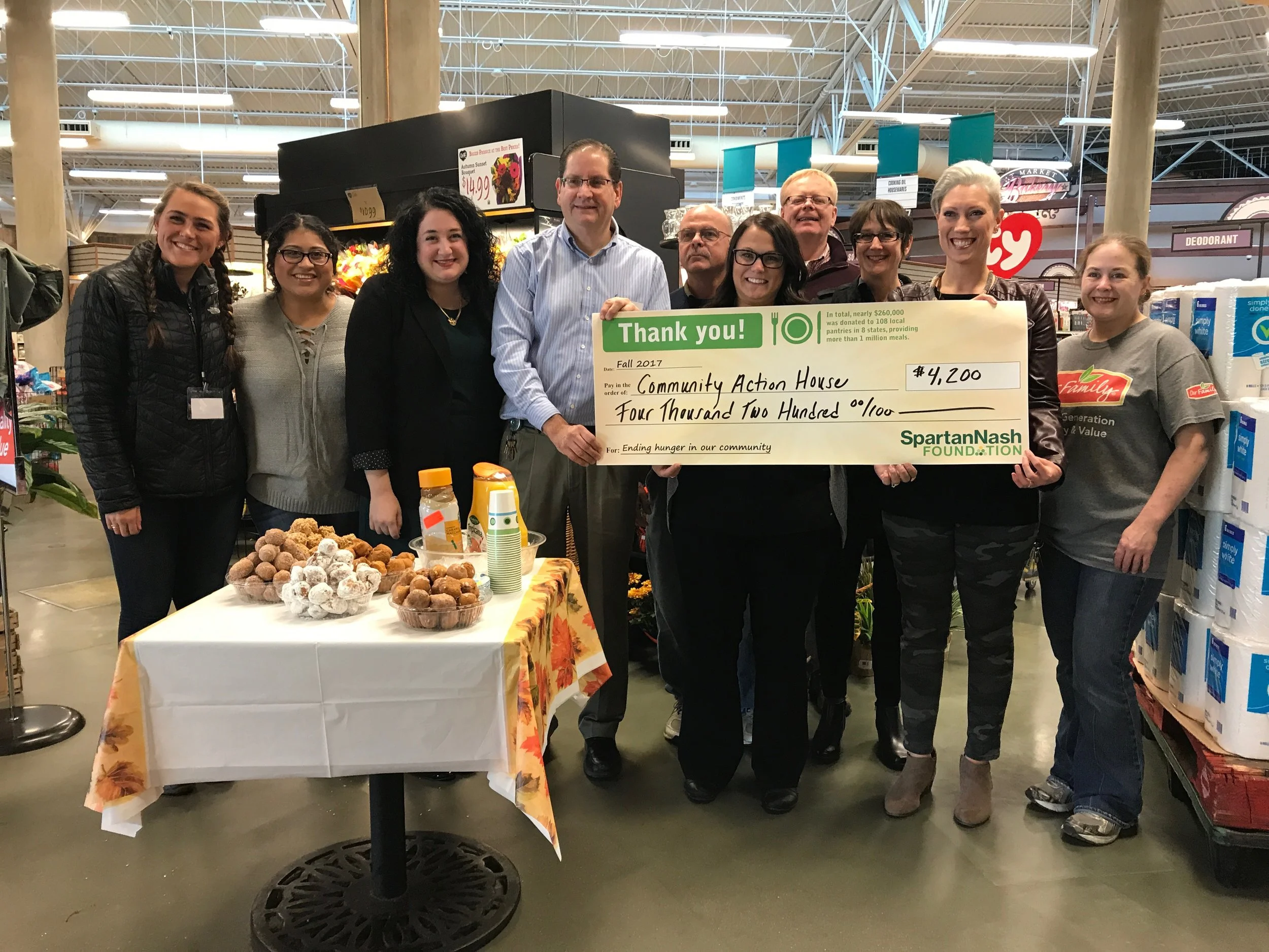 Staff of D&W, Family Fare, and Community Action House gathered for a presentation on Nov. 7, 2017.