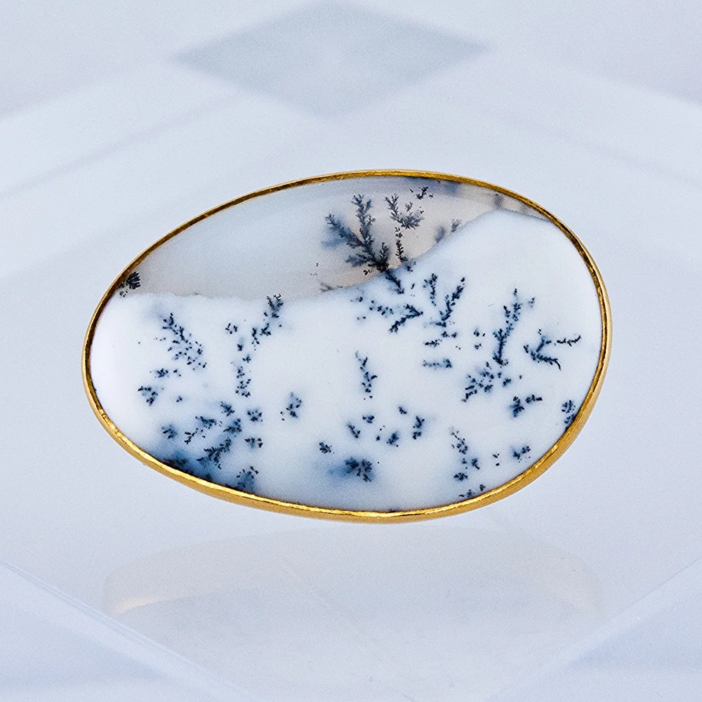 Yes, it's really a gem and not a miniature painting! A black and white version of "common opal", which features fern-like inclusions of manganese, creating a tranquil winter scene. This one makes a truly unique brooch with a freeform shape. 24k bezel, 18k yellow gold elsewhere. (SOLD- ask us about custom ordering a similar piece!)