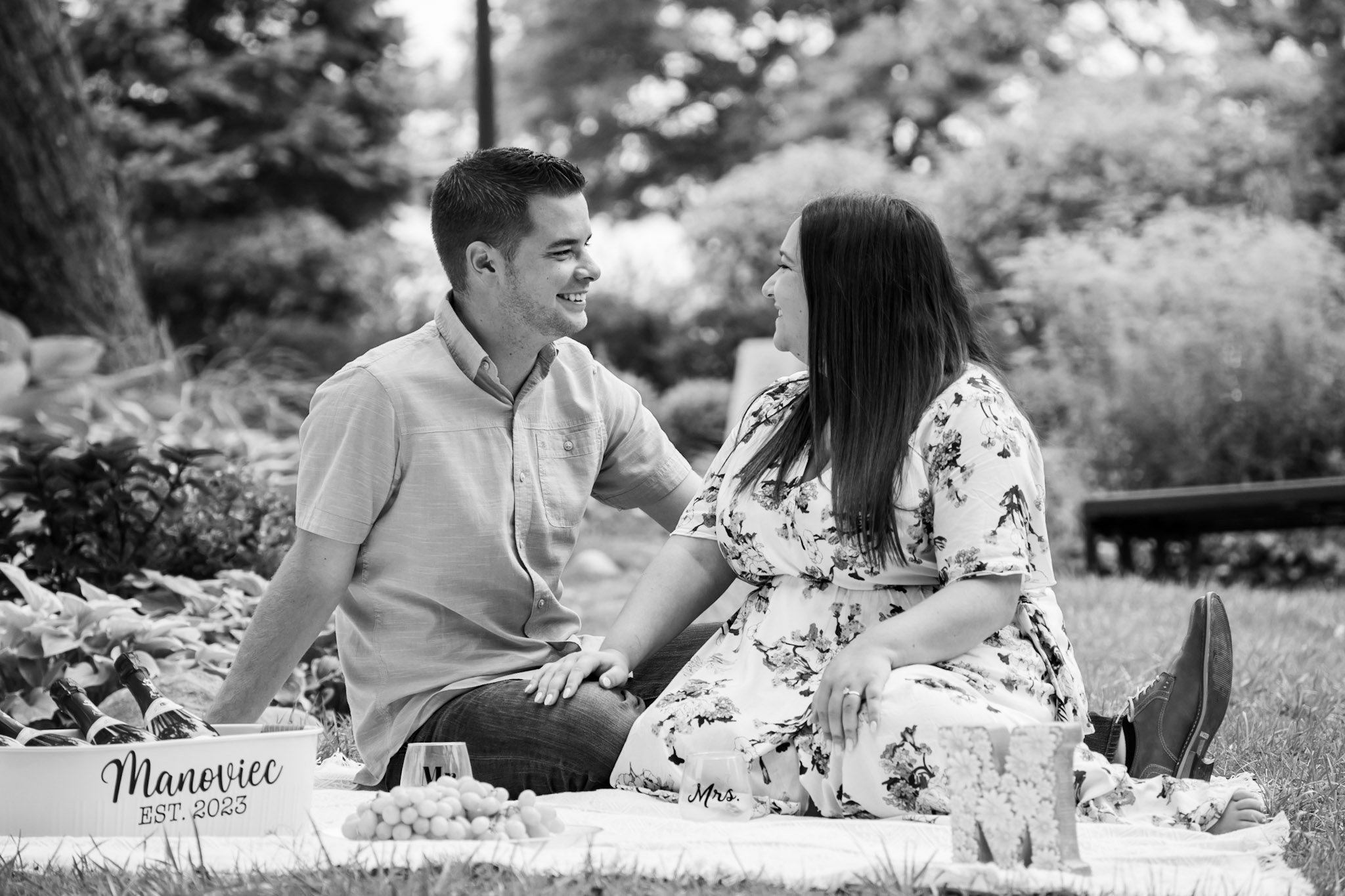 Taylor and Johnny enjoying a picnic during their engagement photoshoot, showcasing their creativity and preparation for one of our cutest shoots so far.