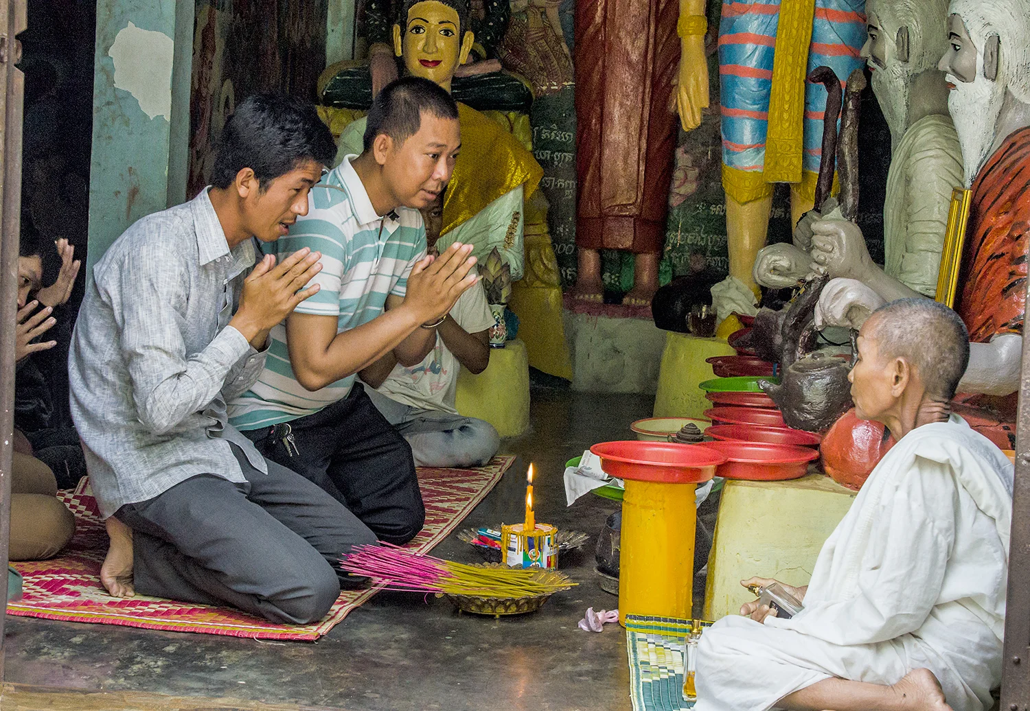 Prayer at Buddhist shrine, near Battambang, Cambodia