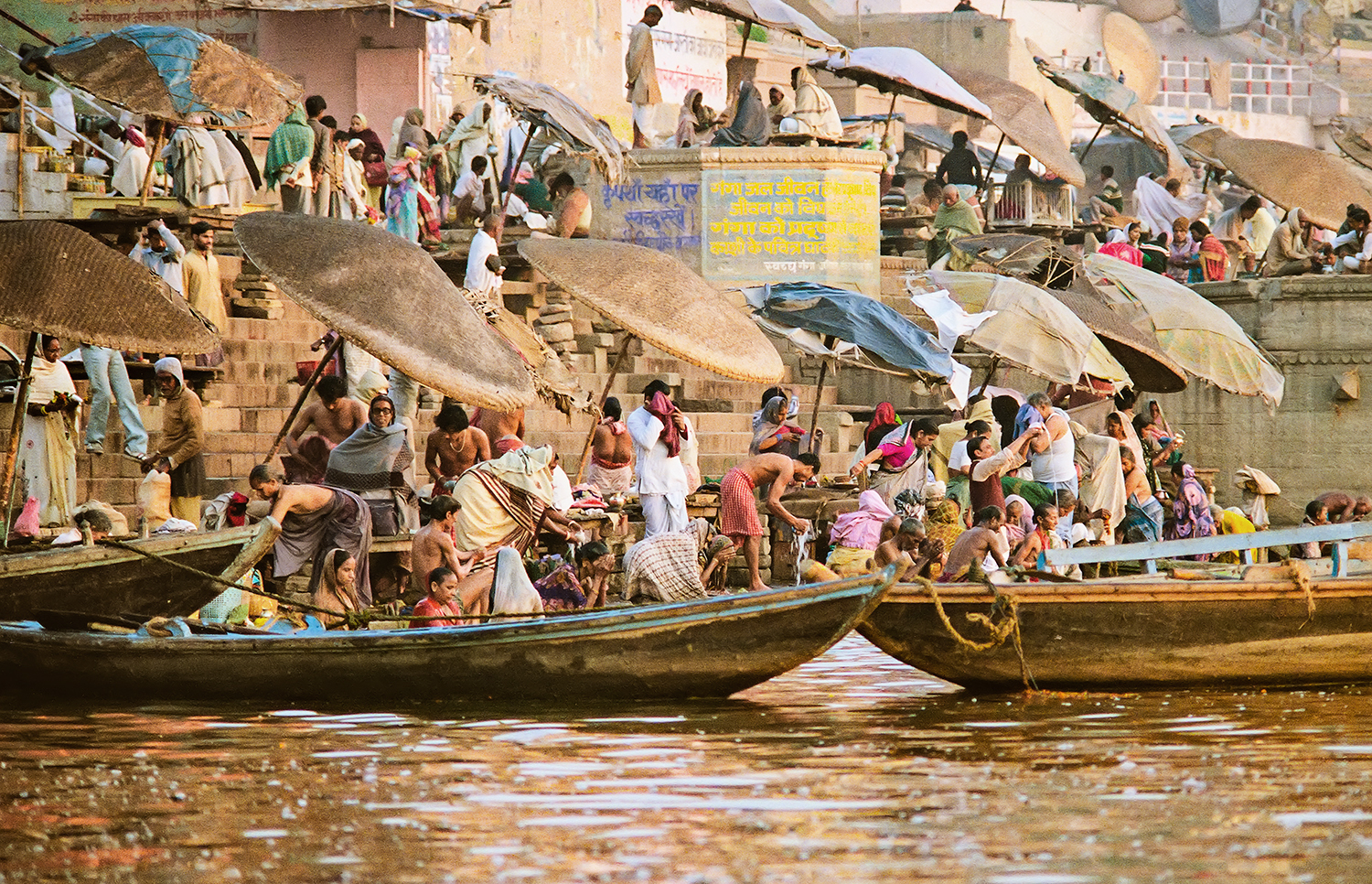   Hindu pilgrims bathing in holy Ganges River, Veranasi, India  