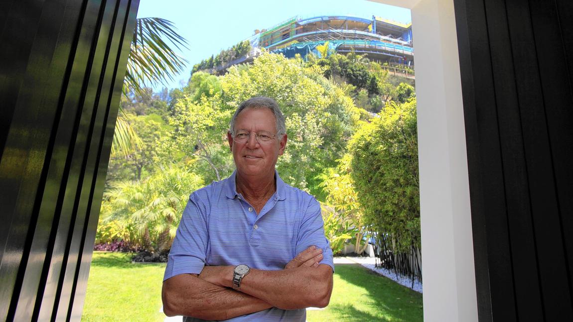 Joseph Horacek III, a veteran entertainment attorney, at the entrance to his Bel-Air home. (Francine Orr / Los Angeles Times)