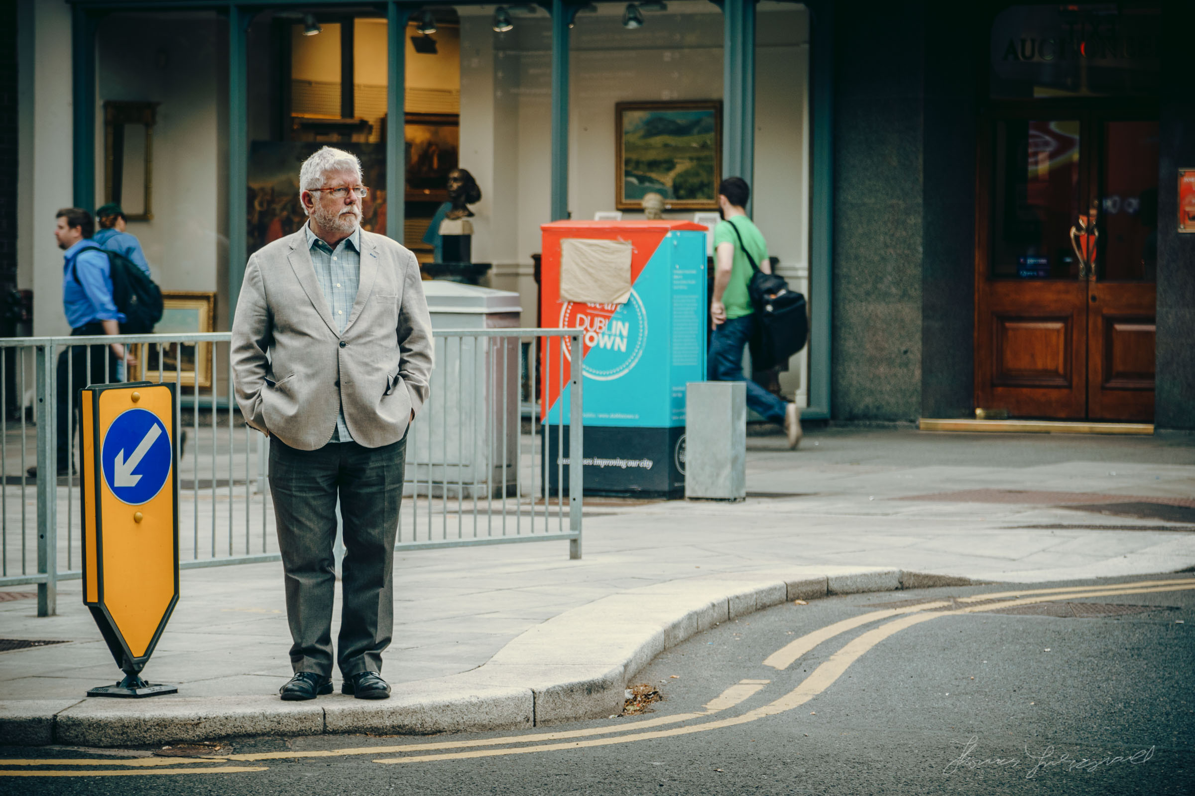 Man Standing at a Crossing