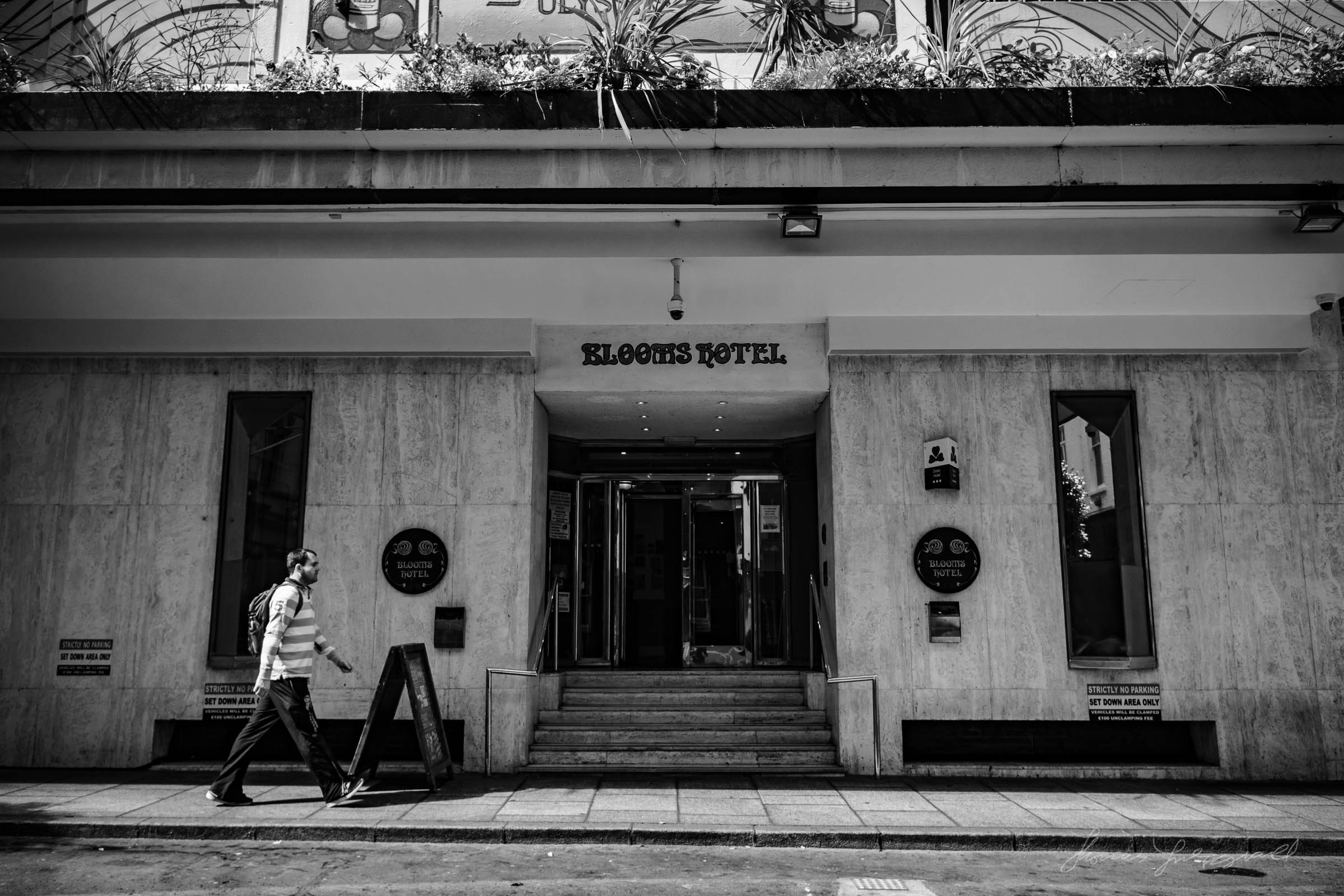 Another Person walking by the Blooms hotel in Dublin