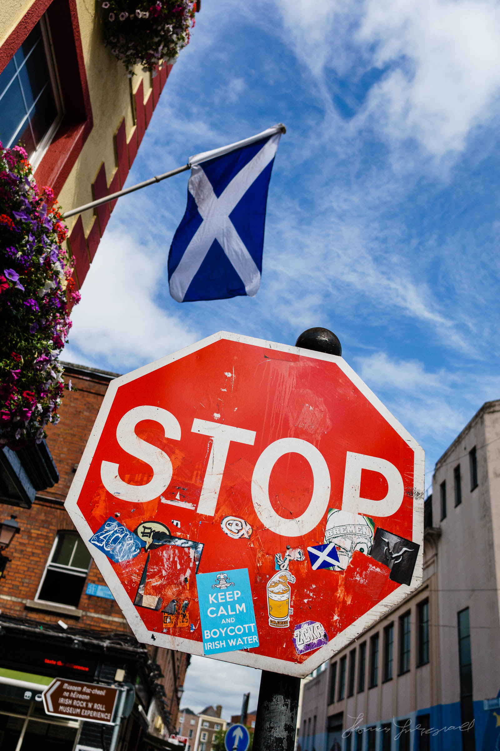 Street Sign in front of the Scottish Flag