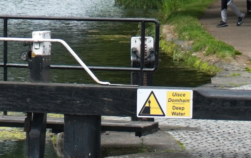 Stair stepping artifacts around the edges (Text on sign and bars over the wood on the lock gates)