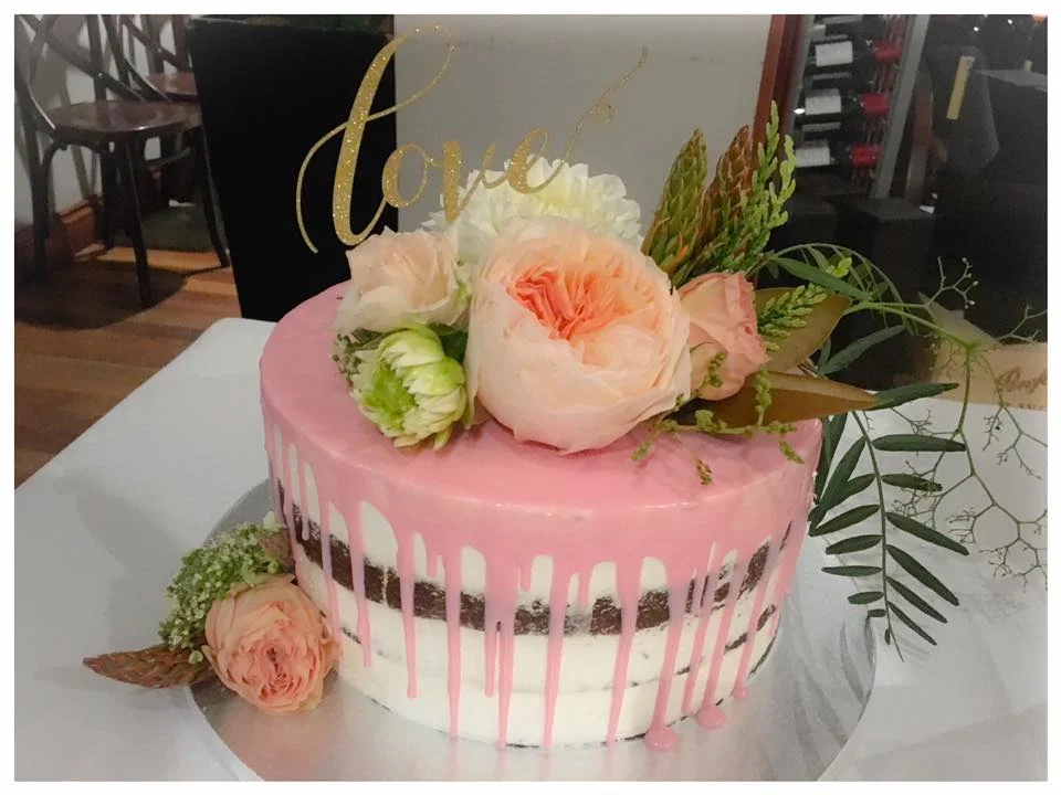 9 inch pink drip wedding cake