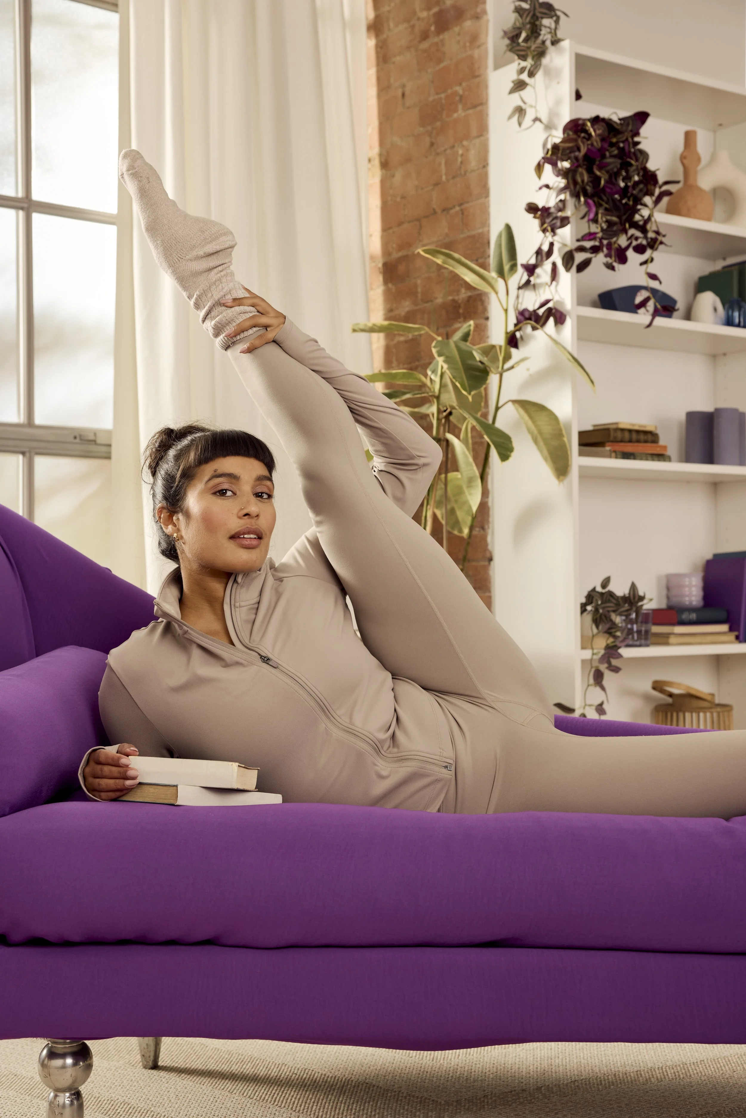 A lady doing the splits as part of a brand campaign for Multi Gyn