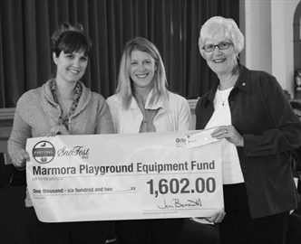 Leigh Nash and Jen Bennett of the Marmora Sno Fest Committee present a cheque in the amount of $1,602 to council at the October 7 meeting at Marmora Town Hall. Councillor Elaine Jones is shown with the presenters. The Sno Fest donation is to help with the Marmora Children's Park.